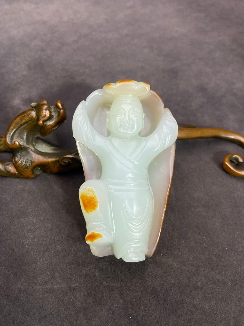 A Exquisite Hotan Jade Human Figure Handheld Carving: A Exquisite Hotan Jade Human Figure Handheld Carving,Ming Dynasty, China,Size:2.8inx1.6inx0.9in ,Weight:84g 和田玉人形手把件,中国明