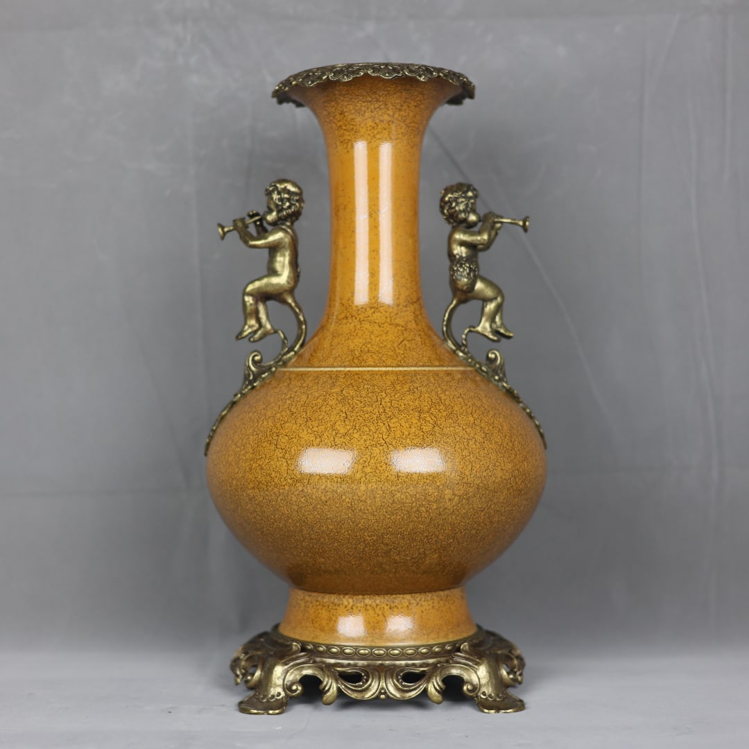An Exquisite Yellow Glazed Inlaid Bronze Double-Ears Vase: An Exquisite Yellow Glazed Inlaid Bronze Double-Ears Vase Qing Dynasty, China Kangxi Six-character Mark Size:16.5inx8.7in铁锈鳝鱼黄釉镶铜天使