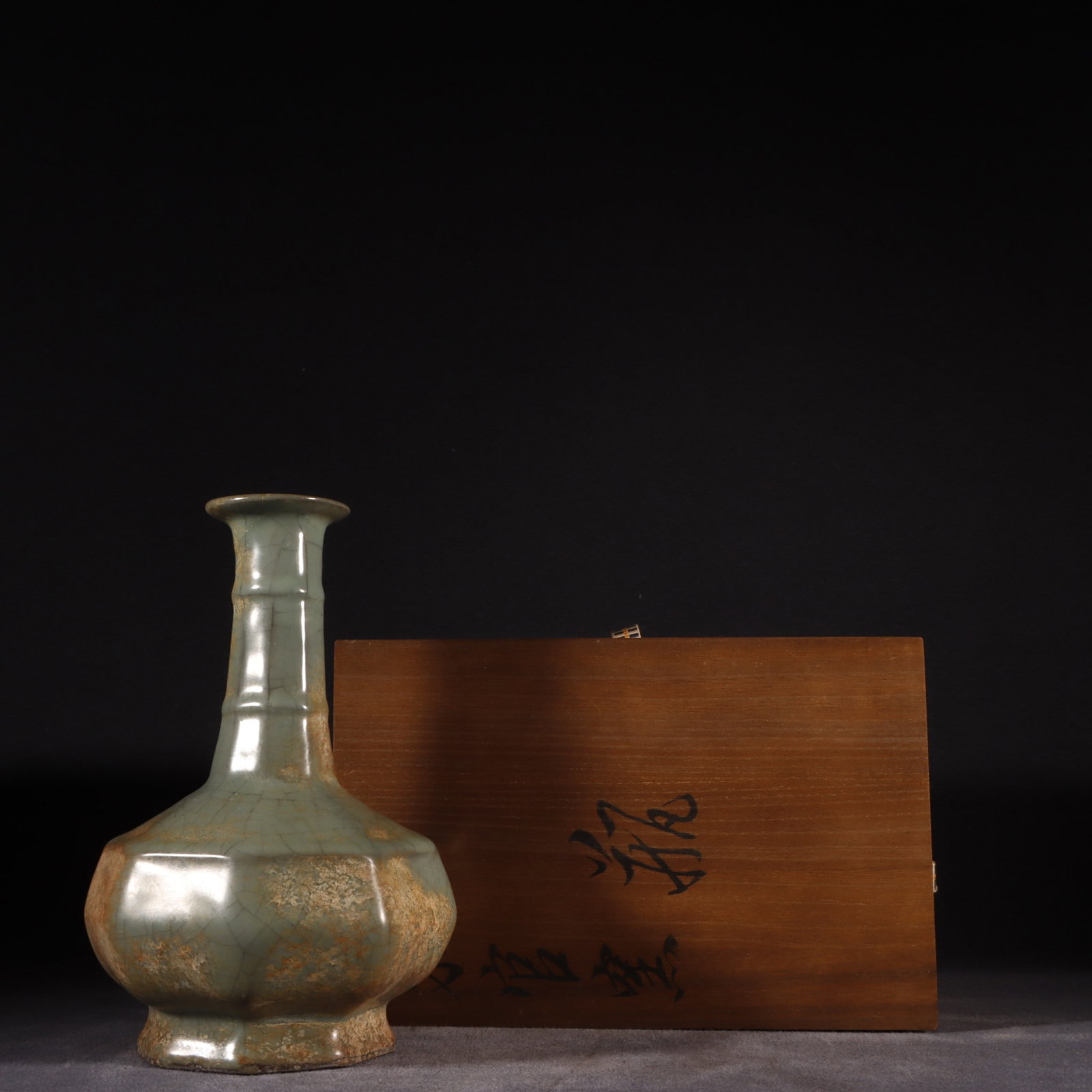 An Exquisite Guan yao Celadon Glazed Vase: An Exquisite Guan yao Celadon Glazed Vase Song Dynasty, China Size:9.1inx5.7in官窑青釉弦纹八棱瓶 中国宋代 Size:23.2cmx14.5