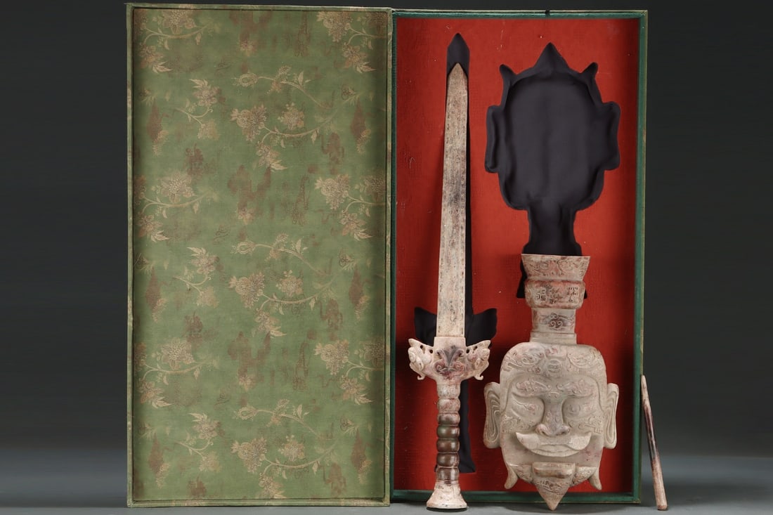 An Exquisite White Jade With Inscription Sword: An Exquisite White Jade With Inscription Sword Qing Dynasty, China Size:26inx4.9in Size:14.8inx8.9in Size:8.1inx0.6in口若悬剑玉 中国清代 Size:66cm