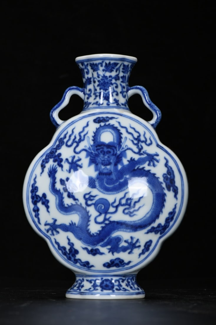 A Exquisite Blue and White Dragon Pattern Double-Ears Vase: A Exquisite Blue and White Dragon Pattern Double-Ears Vase,Qing Dynasty, China,Qianlong Six-character Mark,Size:7.8inx2inx9.1inx2.4in 青花龙纹双耳瓶,中&