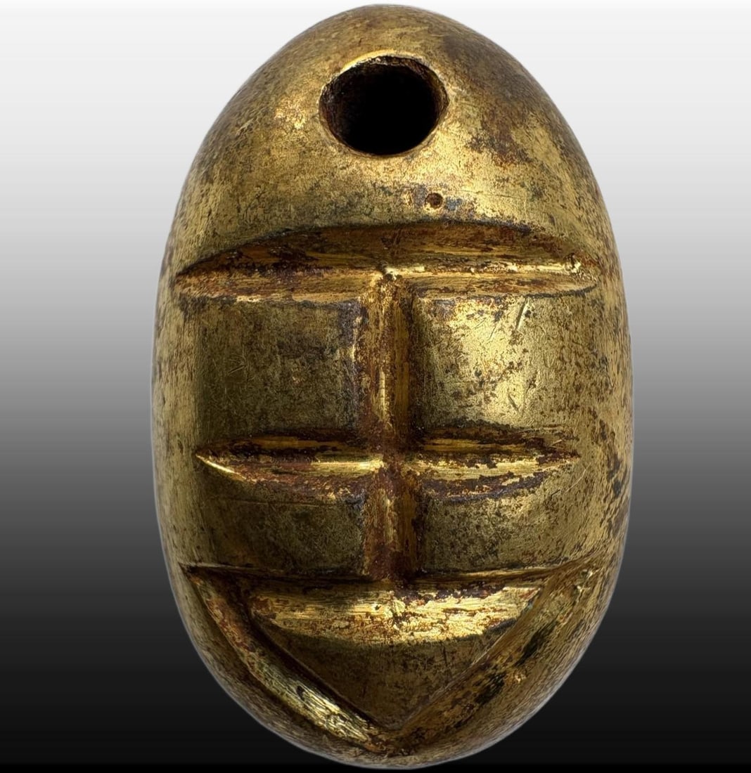 A Exquisite Gilt Bronze Coin: A Exquisite Gilt Bronze Coin,Han Dynasty, China,Size:1.1inx0.7in,Weight:21.6g 铜鎏金鬼脸金钱,中国汉代