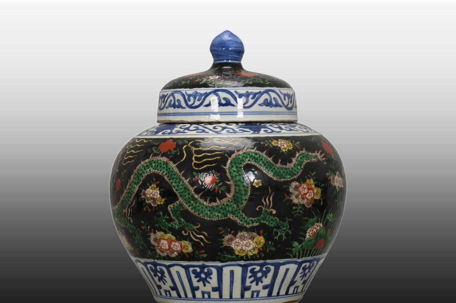 A Exquisite Black Ground Blue and White Wucai Dragon Pattern Jar (1 of 8)