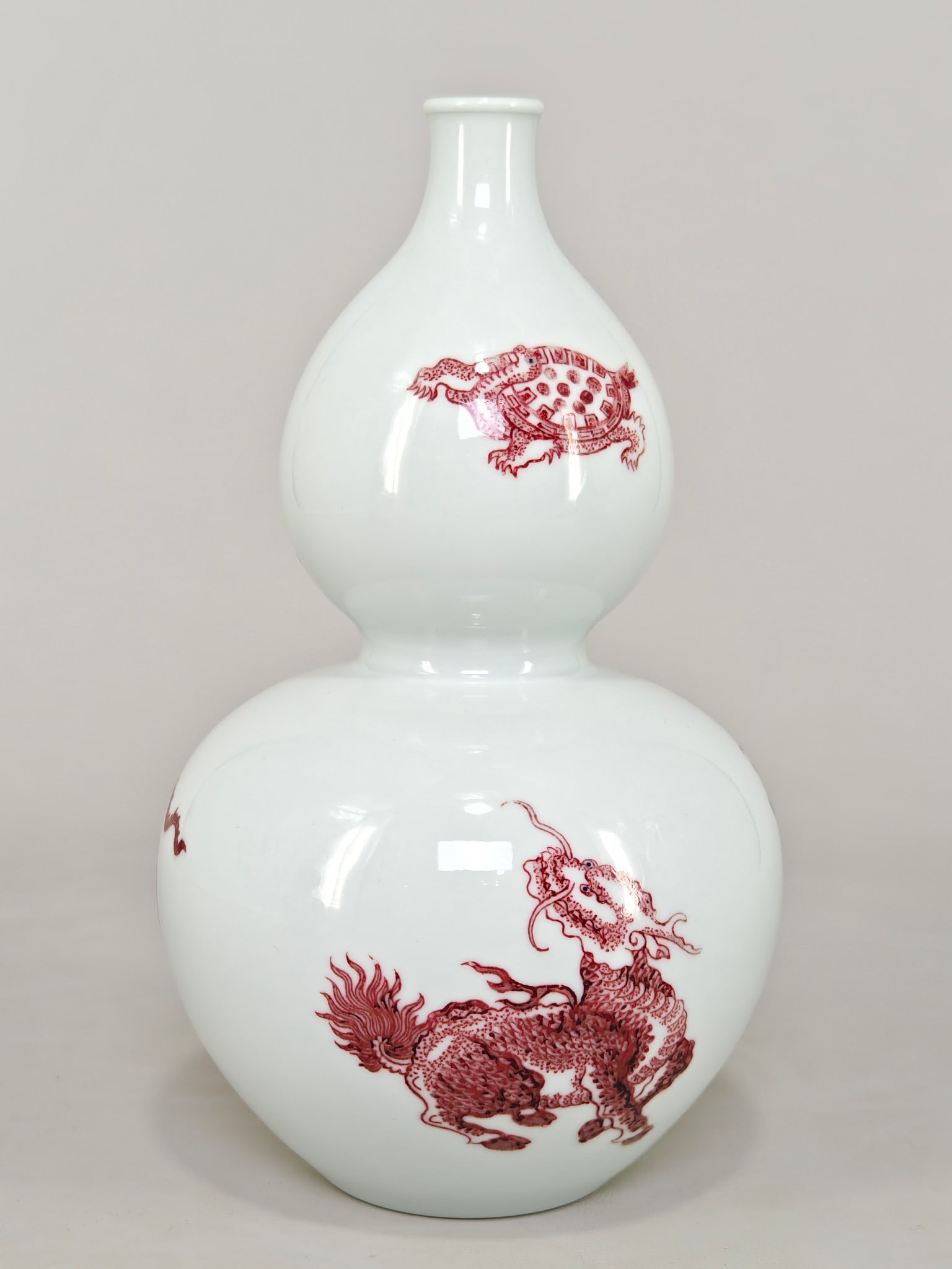 A Exquisite Underglaze-Red Auspicious Beast Pattern Gourd Vase: A Exquisite Underglaze-Red Auspicious Beast Pattern Gourd Vase,Qing Dynasty, China,Kangxi Six-character Mark,Size:8.3inx5.1in 釉里红瑞兽纹葫芦瓶,&