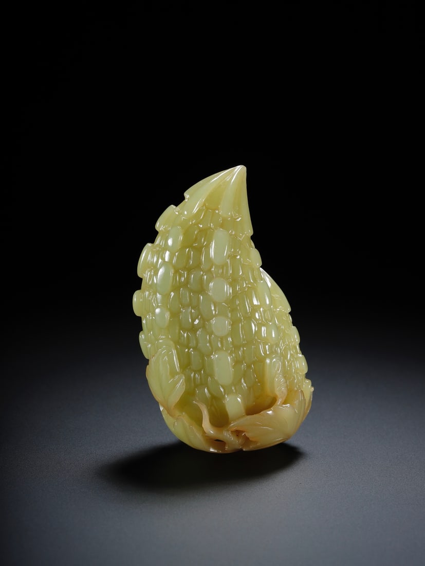 A Exquisite Hotan Yellow Jade Flower and Fruit Pattern Ornament: A Exquisite Hotan Yellow Jade Flower and Fruit Pattern Ornament,Qing Dynasty, China,Size:3.1inx1.8inx1.2in,Weight:136.8g 和田黄玉瓜果摆件,中ࢲ