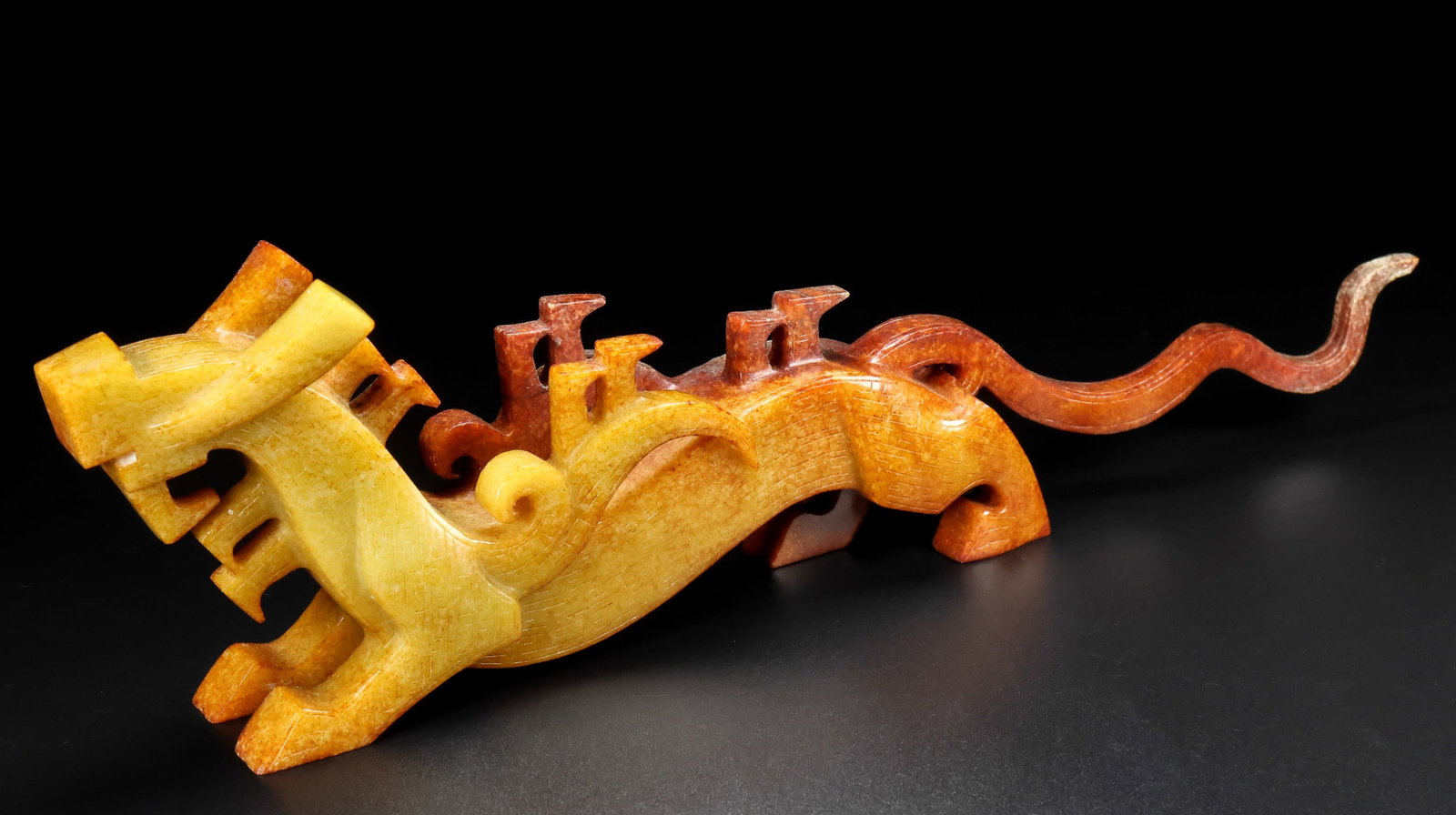 A Exquisite Hotan Jade Auspicious Beast Ornament: A Exquisite Hotan Jade Auspicious Beast Ornament,Han Dynasty, China,Size:12.6inx1.4inx3.5in,Weight:570g 和田玉瑞兽摆件,中国汉代