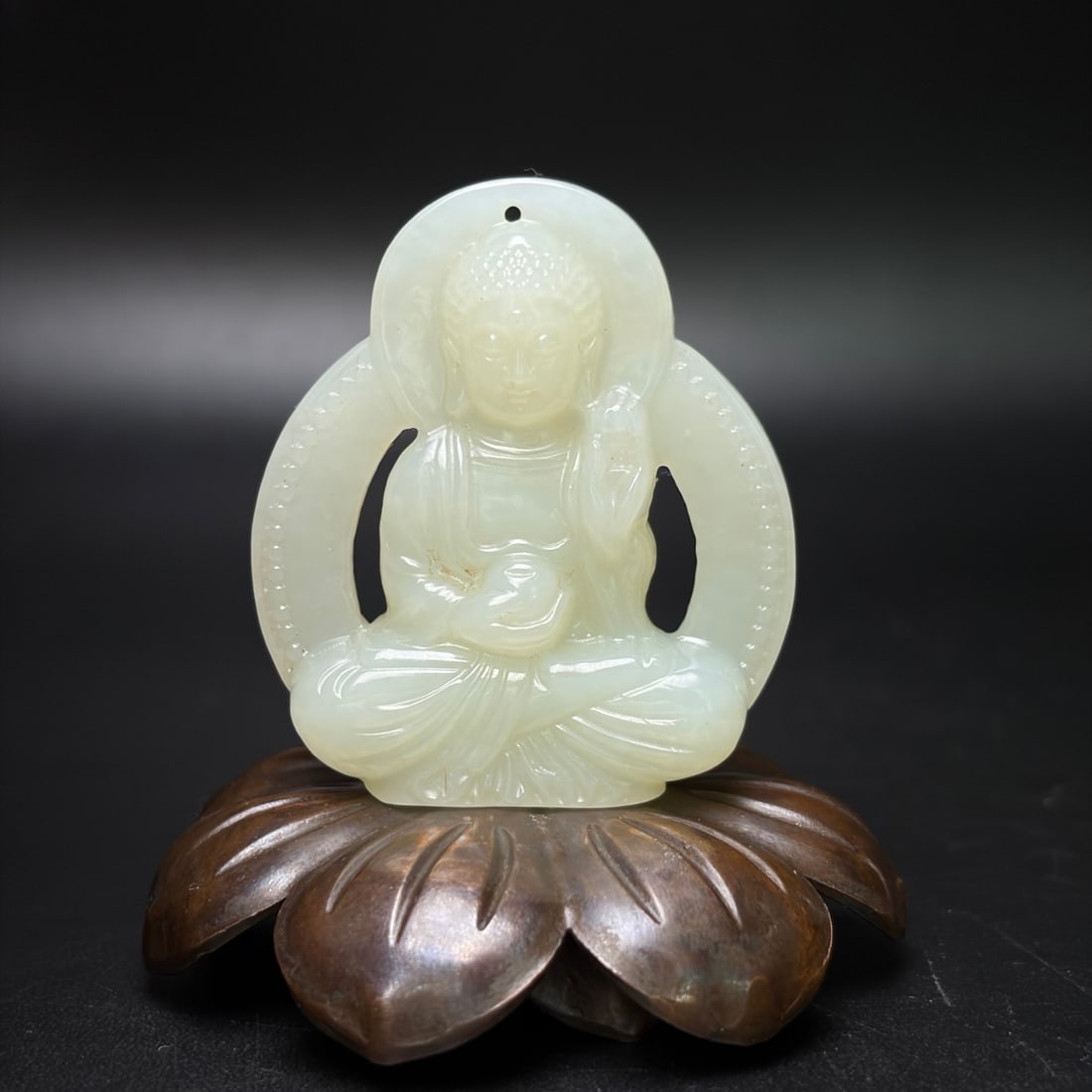 A Exquisite Hotan Jade Buddha Pendant: A Exquisite Hotan Jade Buddha Pendant,Qing Dynasty, China,Size:1.9inx1.7inx0.4in, Weight:33g 和田玉佛佩,中国清代