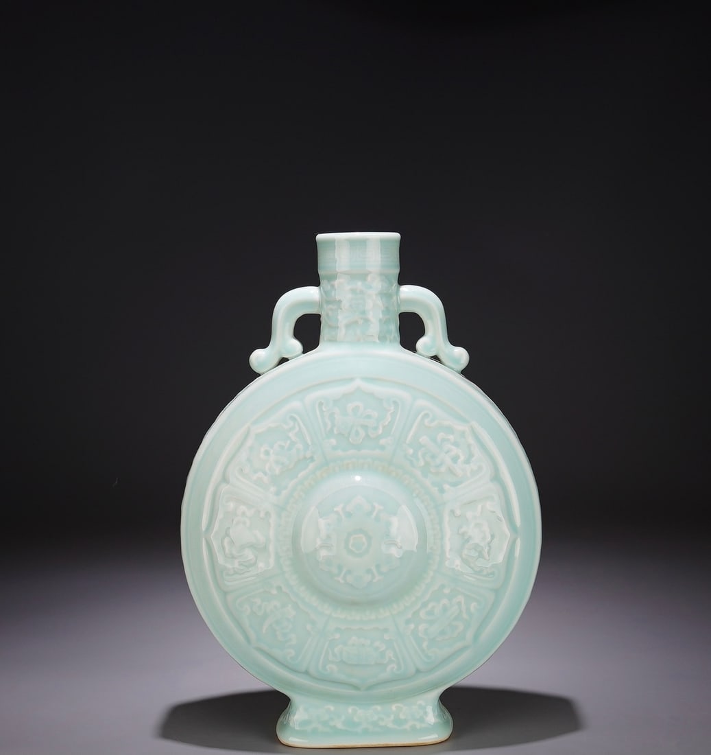 A Exquisite Sky Blue Glazed Eight Treasures Pattern Vase: A Exquisite Sky Blue Glazed Eight Treasures Pattern Vase,Qing Dynasty, China,Qianlong Six-character Mark,Size:14.2inx9.4in