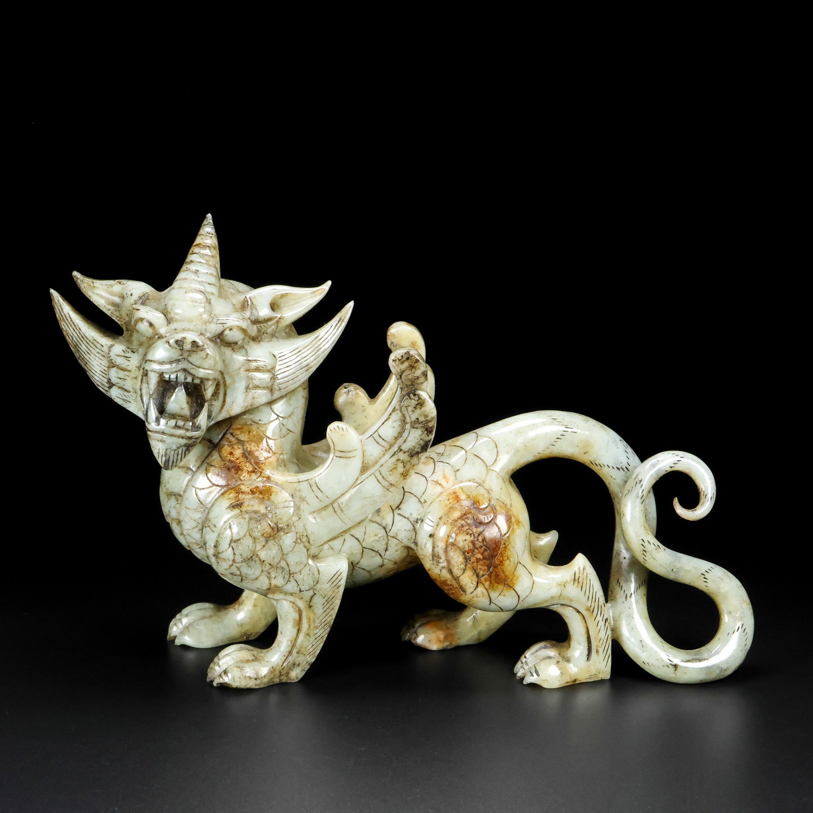 A Exquisite Hotan Jade Qilin Ornament: A Exquisite Hotan Jade Qilin Ornament,Qing Dynasty, China,Size:9.4inx5.9inx2.4in ,Weight:868g 和田玉独角兽摆件,中国清代