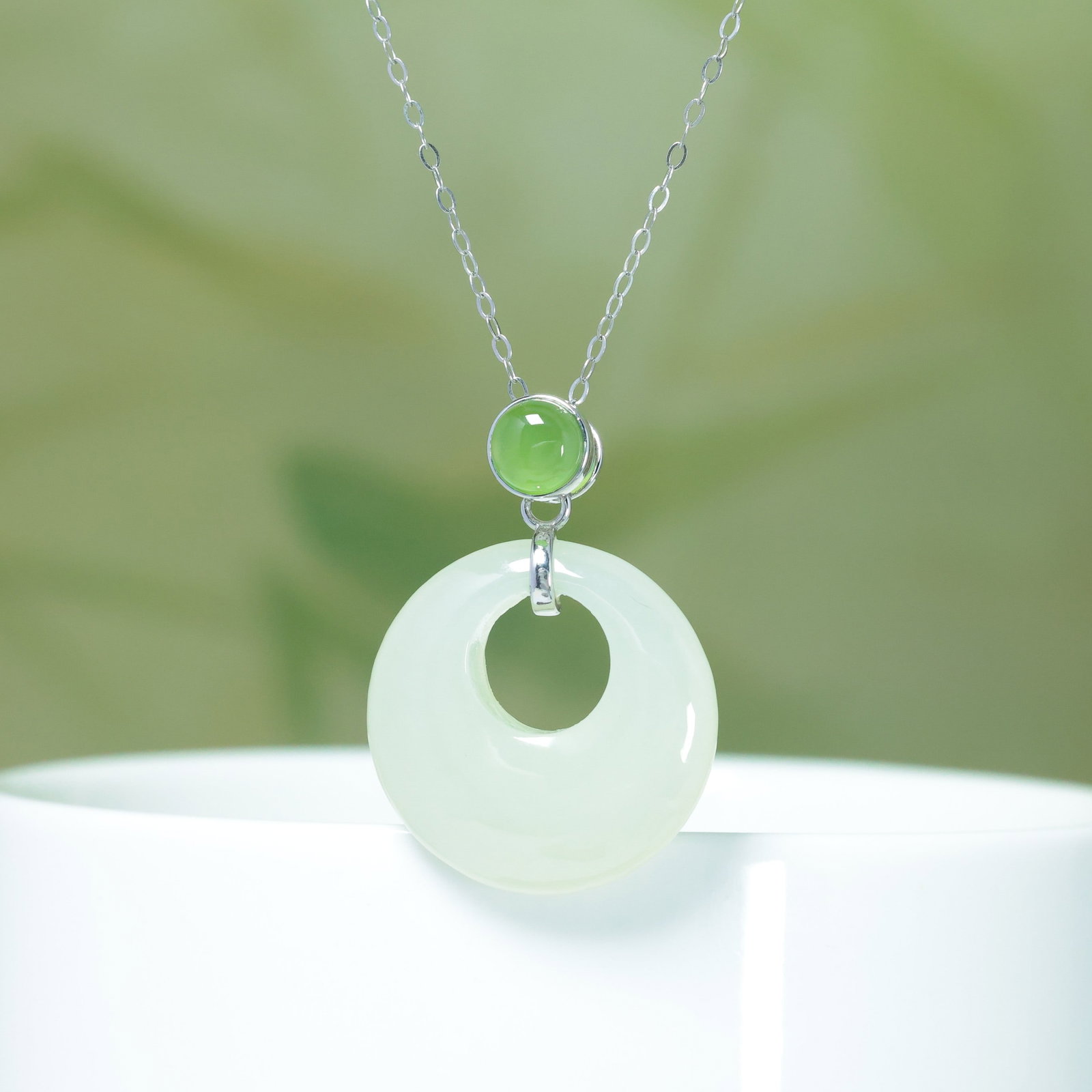 A Exquisite Silver Inlaid Hotan Jade Pendant: A Exquisite Silver Inlaid Hotan Jade Pendant,Size:0.8inx0.8in 银镶和田玉公主扣加绿吊坠