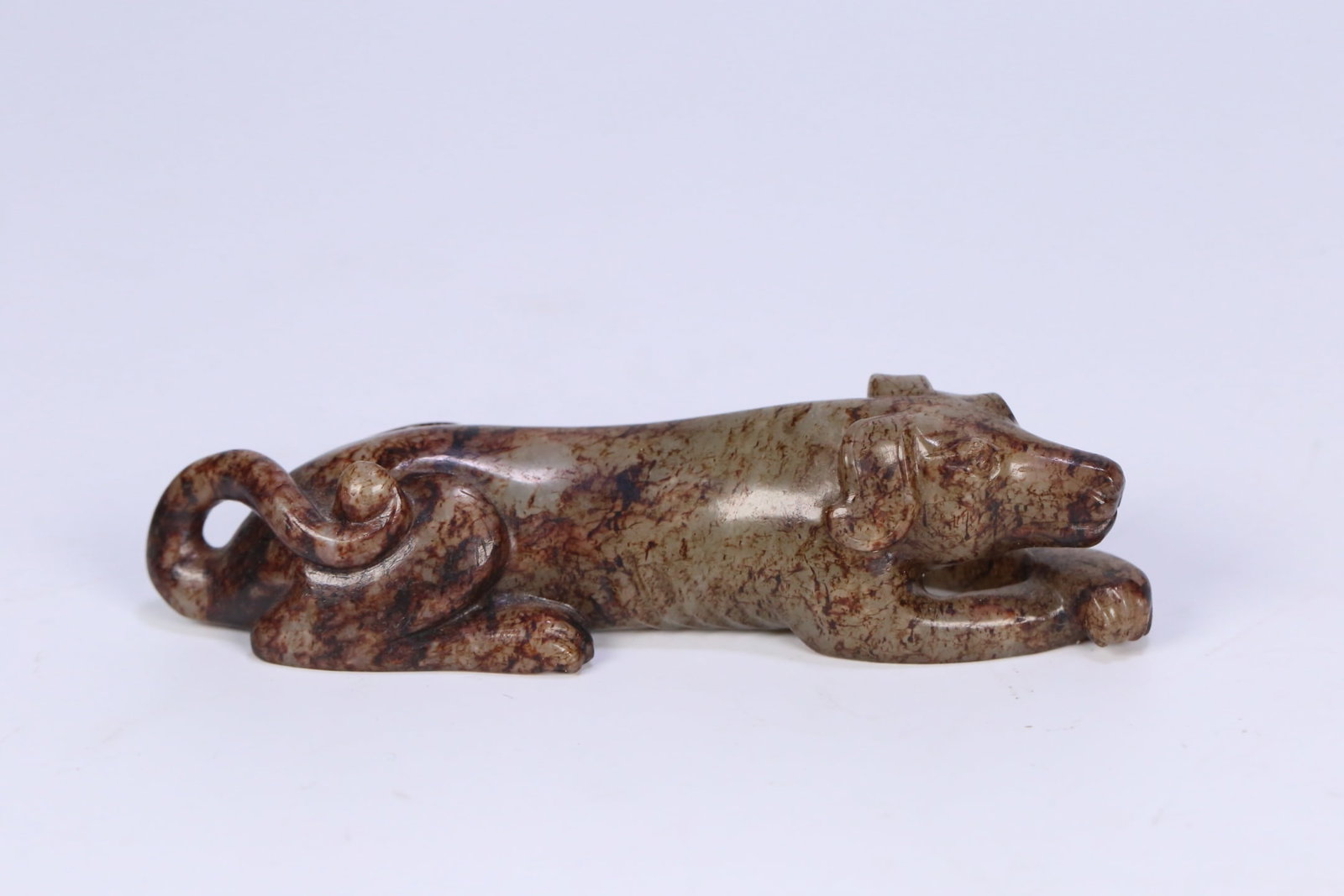 An Exquisite White Jade Dog Ornament: An Exquisite White Jade Dog Ornament,Qing Dynasty, ChinaSize:4.3inx1.3inx1.1in,Weight:113.7g白玉狗摆件,中国清代,Size:11cmx3.3cmx2.8cm,Weight:113.7