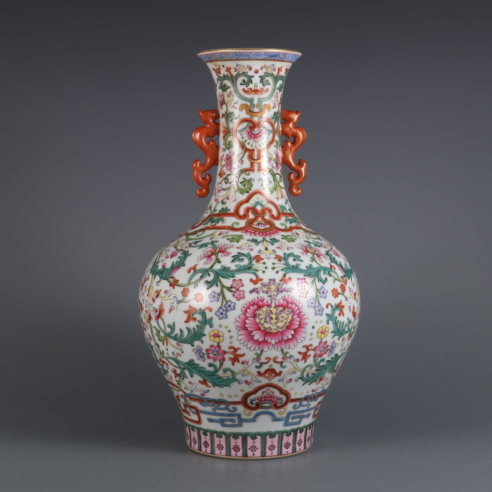 A Rare Famille-Rose Lotus Pattern Double-Ears Vase: A Rare Famille-Rose Lotus Pattern Double-Ears Vase Qing Dynasty, China Qianlong Six-character MarkSize:14.1inx7.7in粉彩缠枝莲纹双耳瓶
