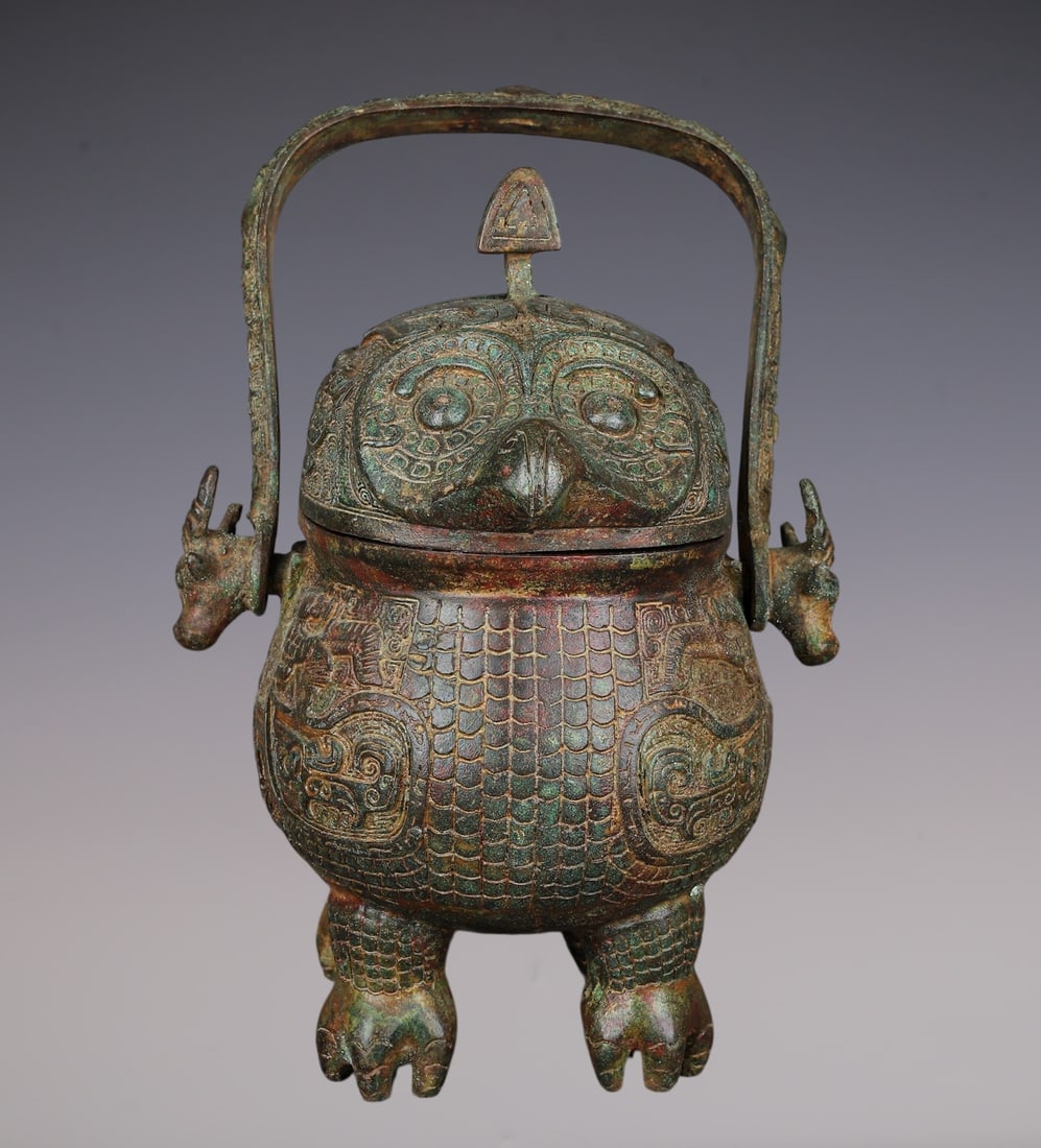 An Archaic Bronze Beast-Face Pattern Beast-head Loop-Handled Pot,With Inscription: An Archaic Bronze Beast-Face Pattern Beast-head Loop-Handled Pot,With Inscription,W.Zhou ,China,Size:8.5inx8.5inx11in,Weight:4460g青铜兽面纹兽首提ੳ