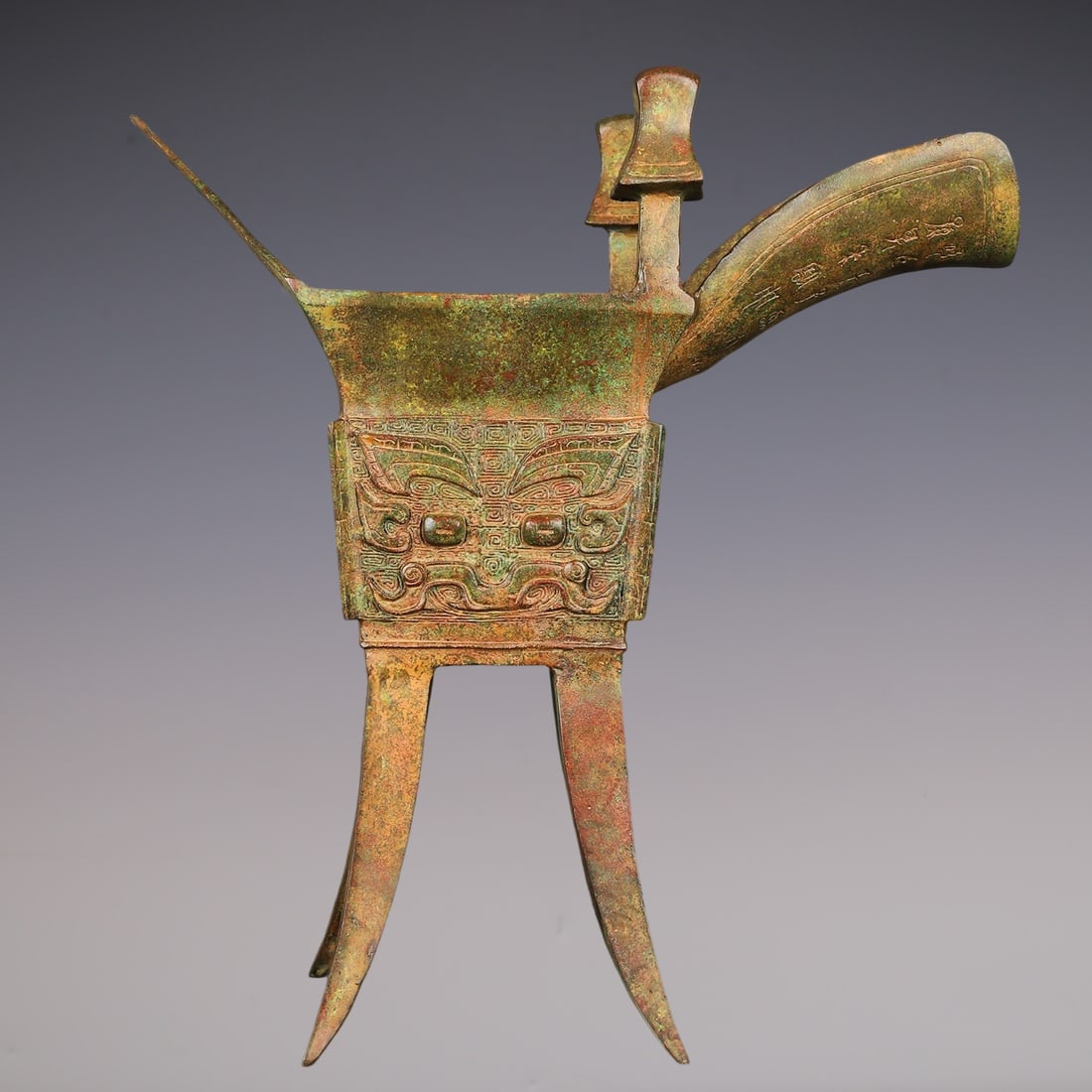 An Archaic Bronze Beast-Face Pattern Double-Ears Four Legs Goblet,With Inscription: An Archaic Bronze Beast-Face Pattern Double-Ears Four Legs Goblet,With Inscription,W.Zhou ,China,Size:16.9inx18.1in,Weight:7200g青铜兽面纹双耳四足