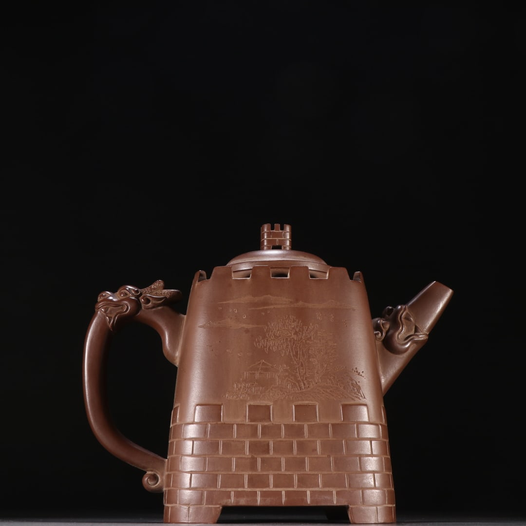 An Exquisite Purple Sands Landscape Pattern Teapot: An Exquisite Purple Sands Landscape Pattern Teapot Qing Dynasty, China Size:6.7inx7.6in紫砂长城茶壶 中国清代 Size:17cmx19.4cm