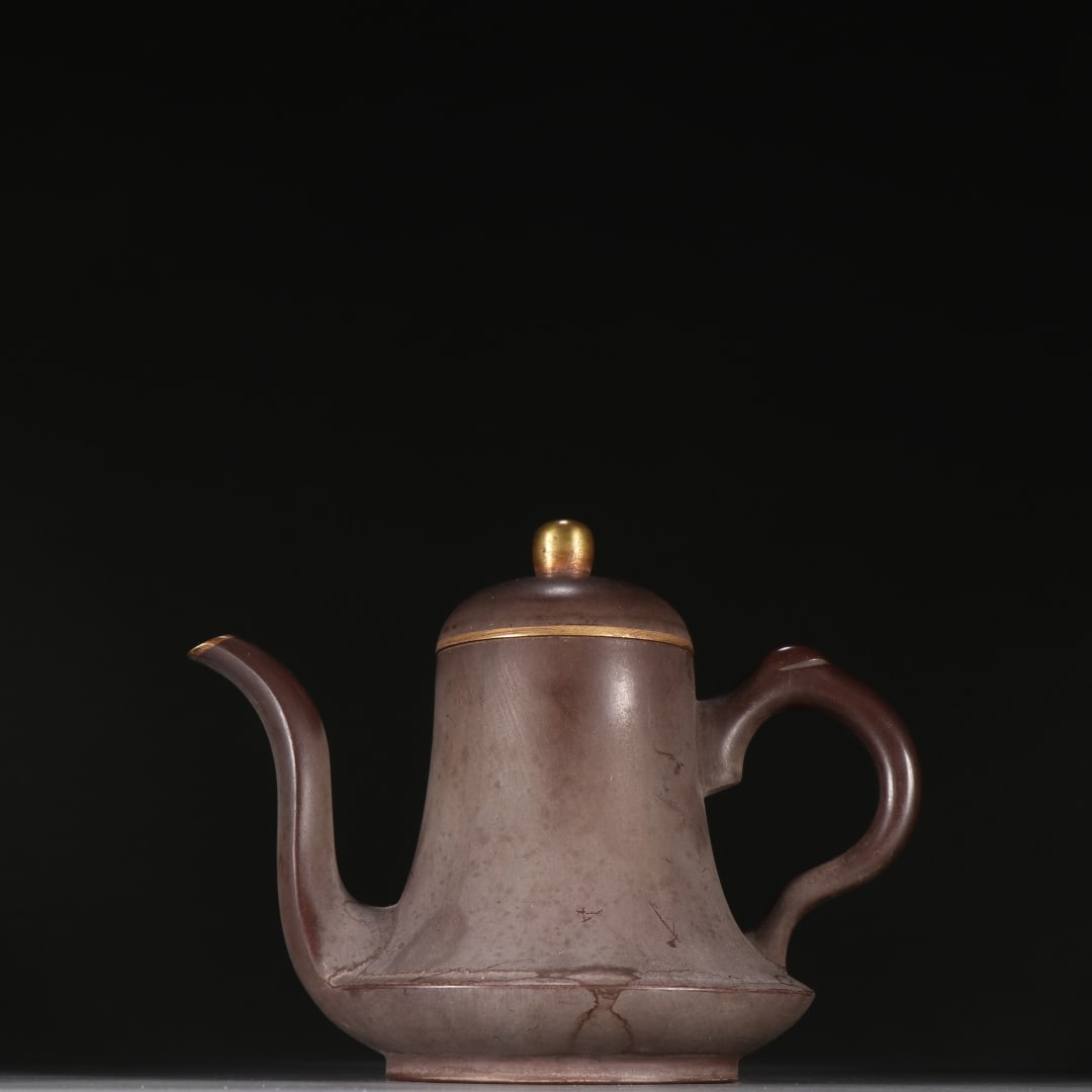 An Exquisite Purple Sands Painted Gold Teapot: An Exquisite Purple Sands Painted Gold Teapot Qing Dynasty, China Size:5.9inx7.2in紫砂描金茶壶 中国清代 Size:15cmx18.3cm