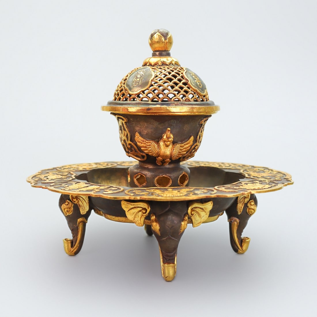 An Exquisite Gilt Bronze Eight Treasures Pattern Phoenix-Ears Elephant Legs Censer: An Exquisite Gilt Bronze Eight Treasures Pattern Phoenix-Ears Elephant Legs Censer,Qing Dynasty,China,Qianlong Four-character Mark,Size:9.1inx9.8in,Weight:2090g铜鎏金八宝