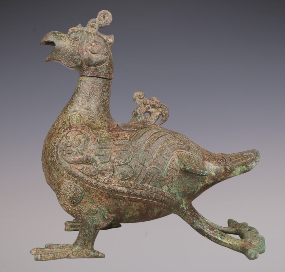 An Archaic Bronze Bird-Shaped Vase: An Archaic Bronze Bird-Shaped Vase,W.Zhou ,China,Size:14.2inx14.6in,Weight:7550g青铜鸟形瓶,中国西周时期,Size:36cmx37cm,Weight:7550g
