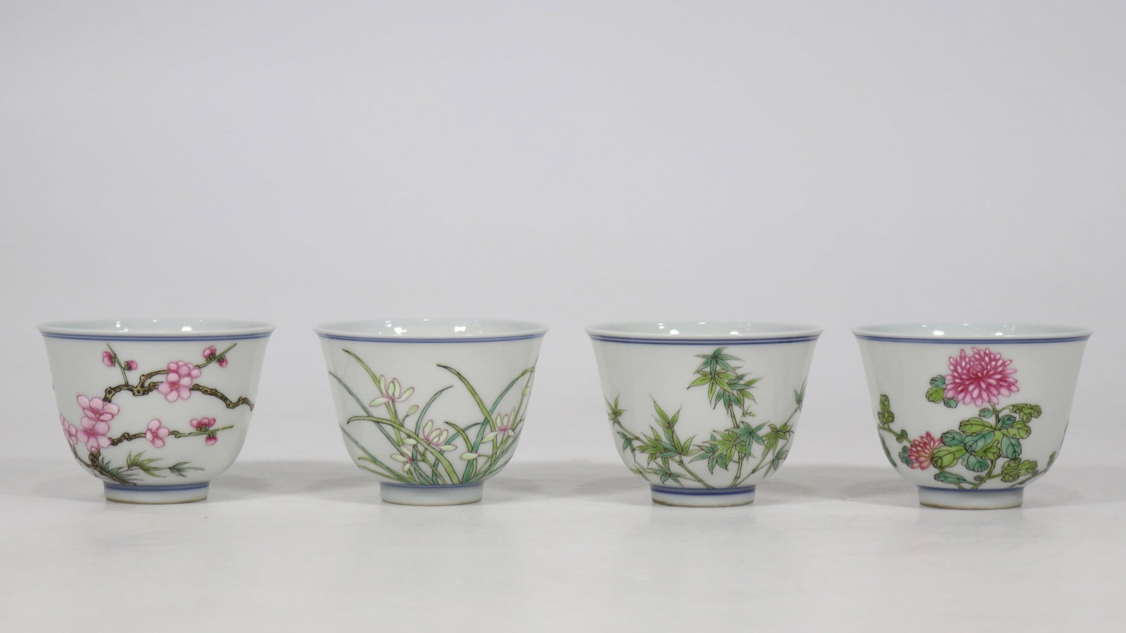 A Set of Fine Famille-Rose Plum Blossom,Orchid Bamboo and Chrysanthemum Pattern Cups,With Poem (1 of 9)