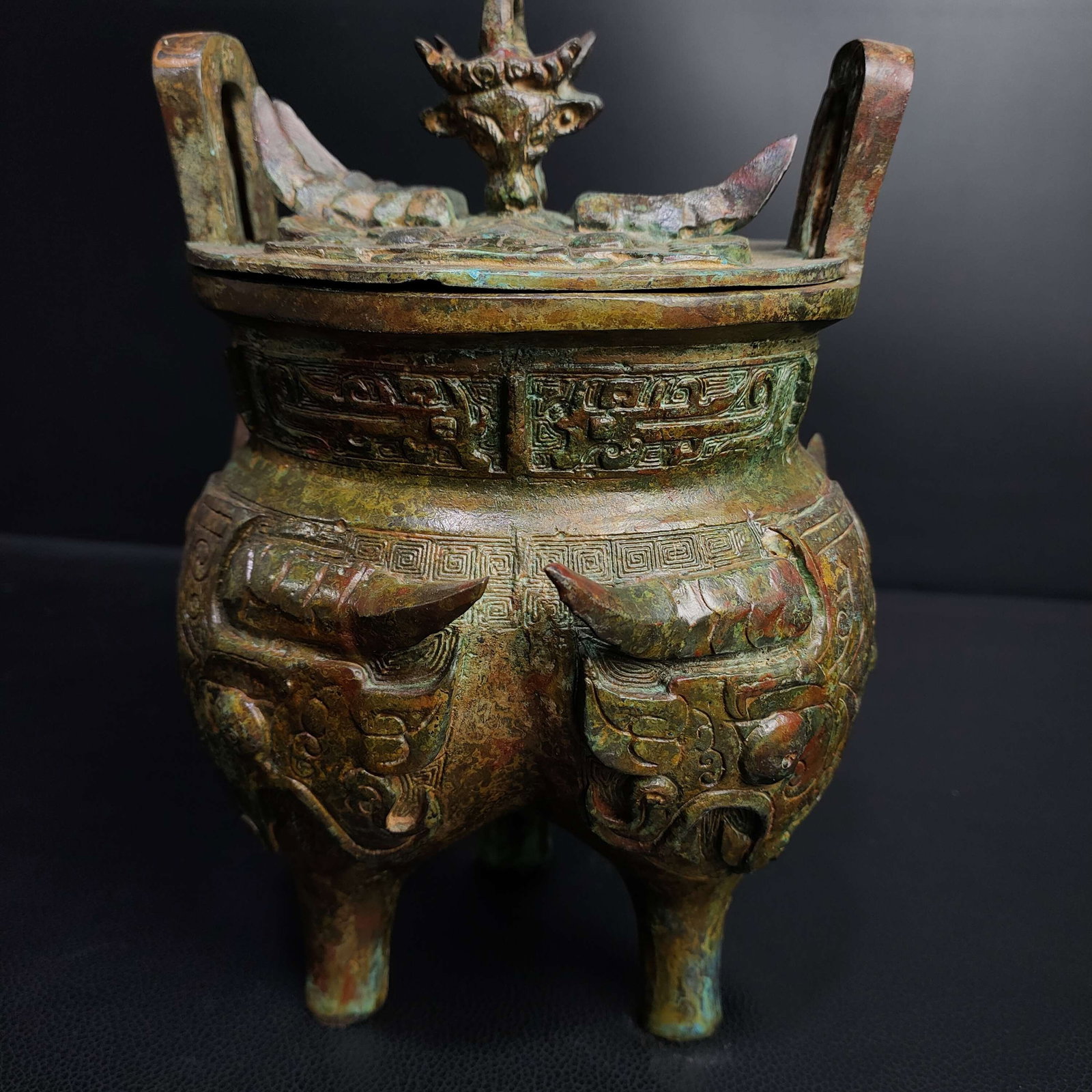 An Archaic Bronze Beast-Face Pattern Double-Ears and Tripod Censer,With Inscription: An Archaic Bronze Beast-Face Pattern Double-Ears and Tripod Censer,With Inscription,the Shang and Zhou Dynasties of China,Size:8.3inx6.3in,Weight:2300g青铜兽面纹双&