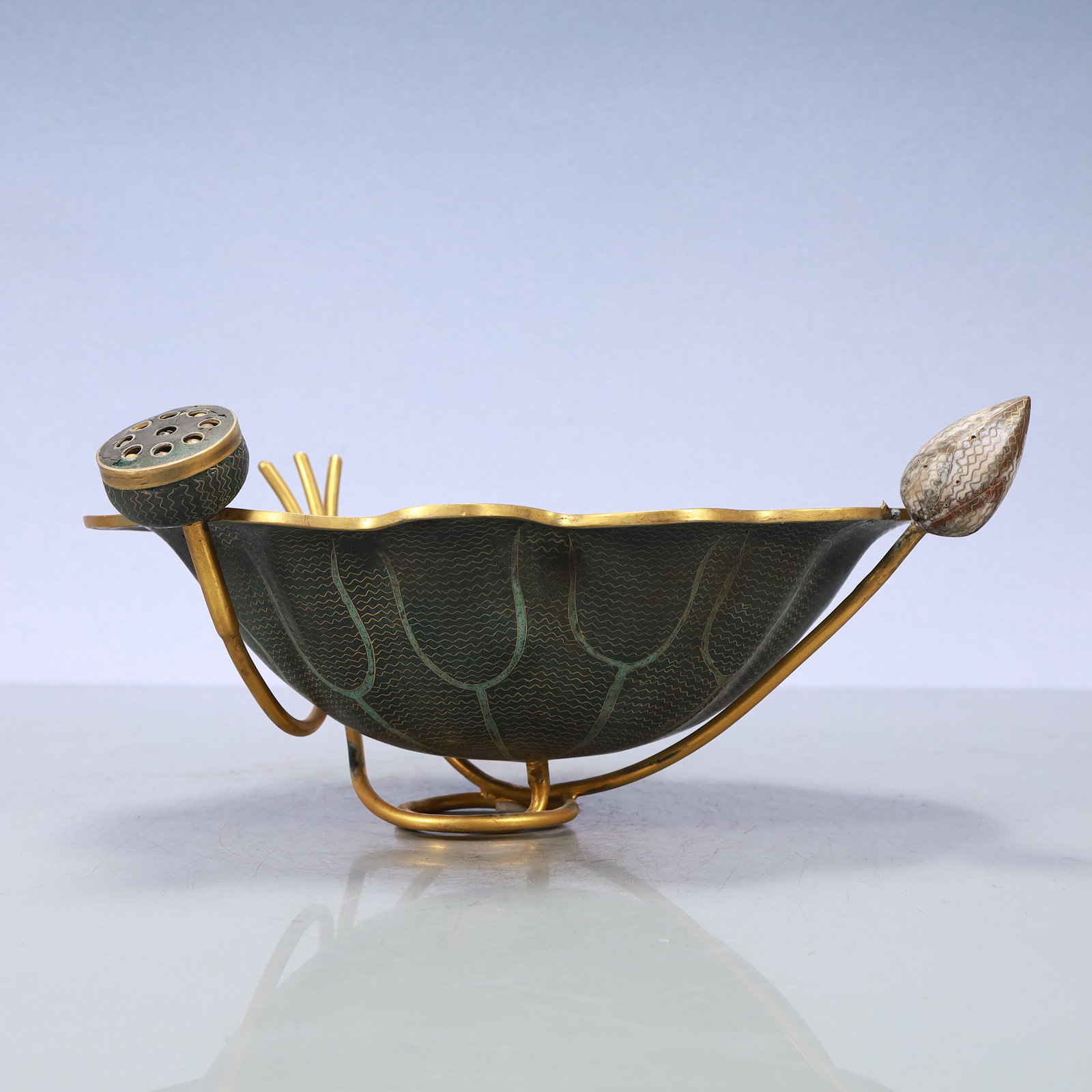 A Exquisite Coppery Lotus-Form Plate: A Exquisite Coppery Lotus-Form Plate Qing Dynasty, China Size:13inx9.6inx5.9in Weight:1350g铜荷花形盘 中国清代 Size:33cmx24.5cmx15cm Weight:1350g