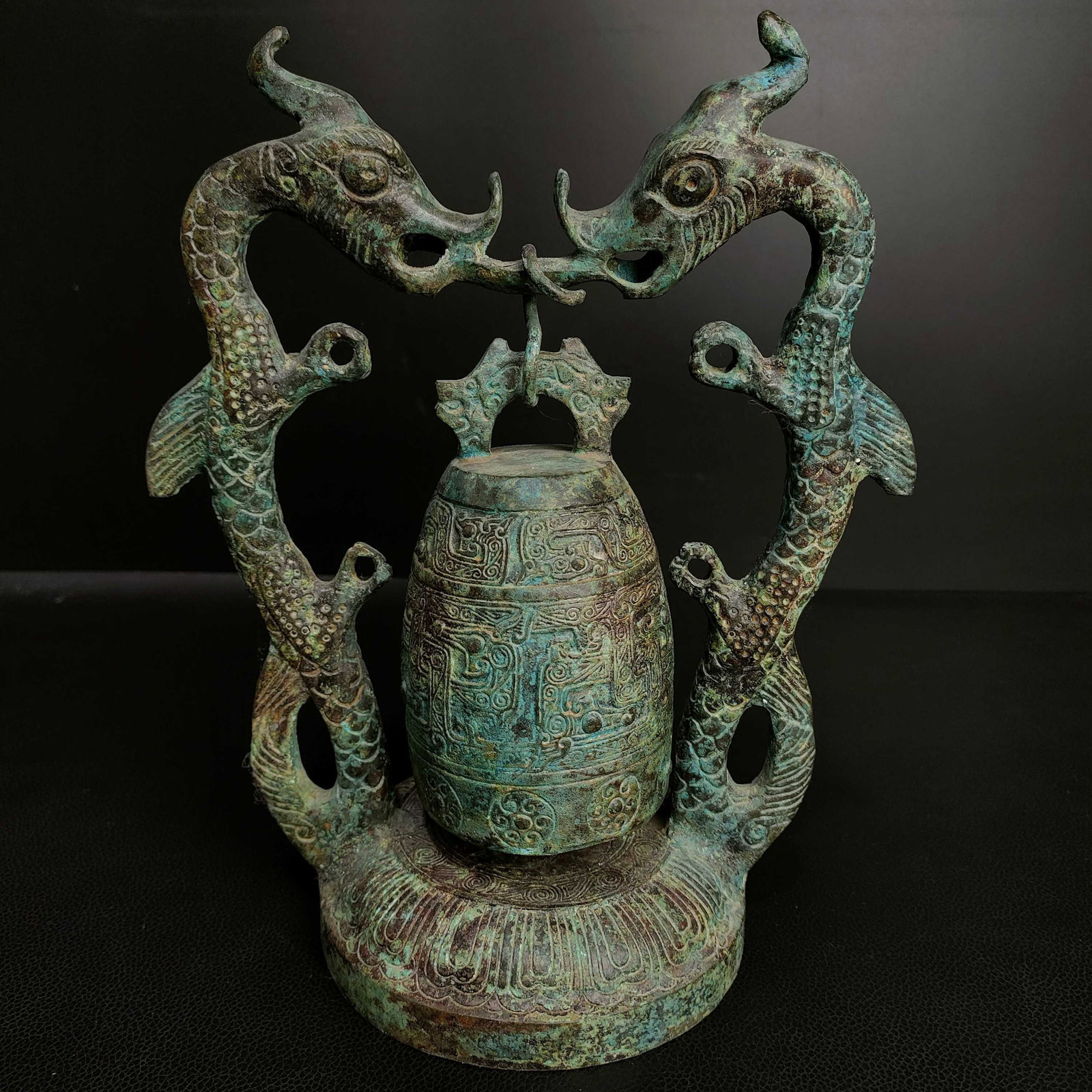 An Archaic Bronze Chi-Dragon Pattern Dragon-Ears Chime: An Archaic Bronze Chi-Dragon Pattern Dragon-Ears Chime,the Warring States period in China,Size:9.8inx8.3in,Weight:1700g青铜螭龙纹龙耳编钟,中
