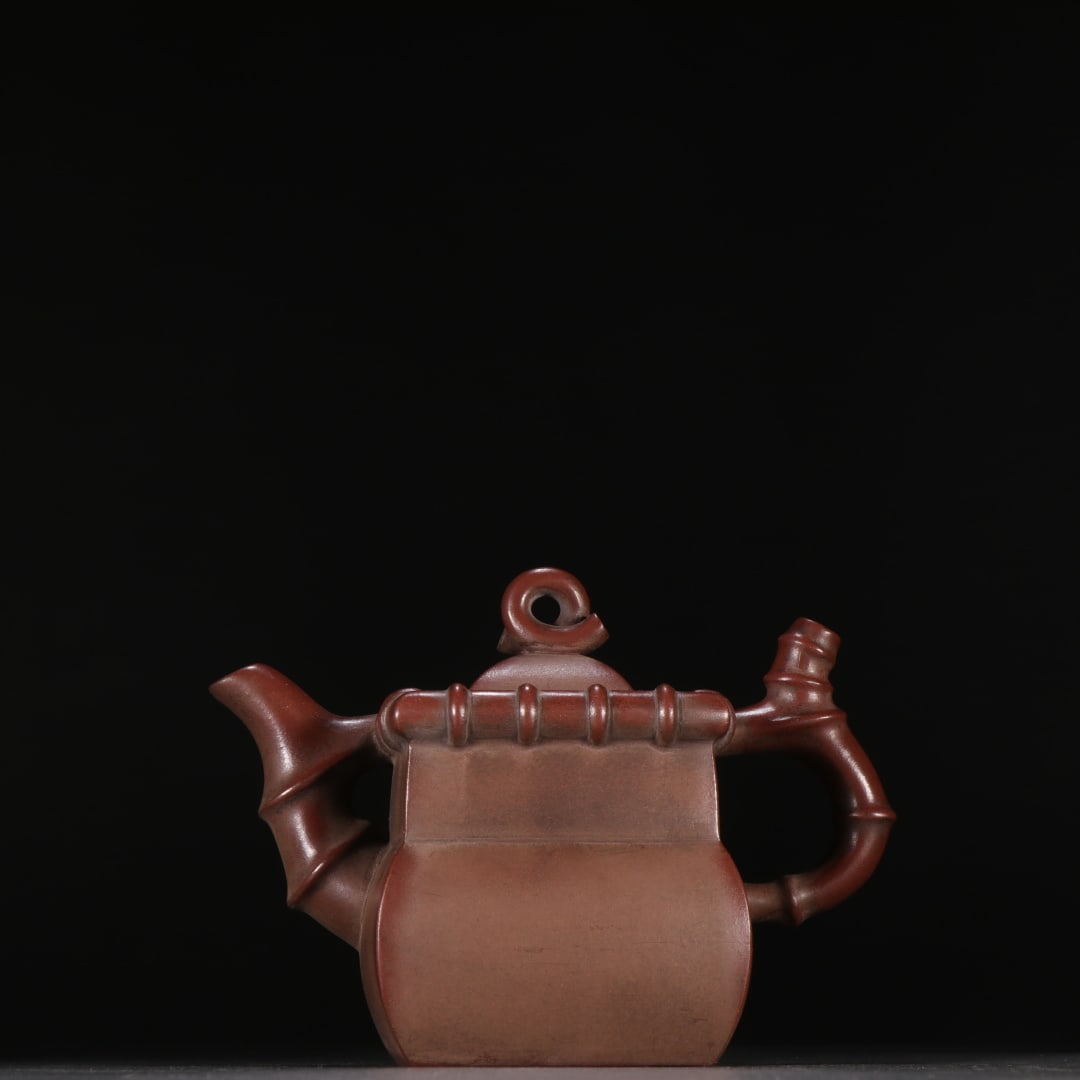 An Exquisite Purple Sands Teapot: An Exquisite Purple Sands Teapot Qing Dynasty, China Size:4.1inx5.7in紫砂四方竹节茶壶 中国清代 Size:10.5cmx14.6cm