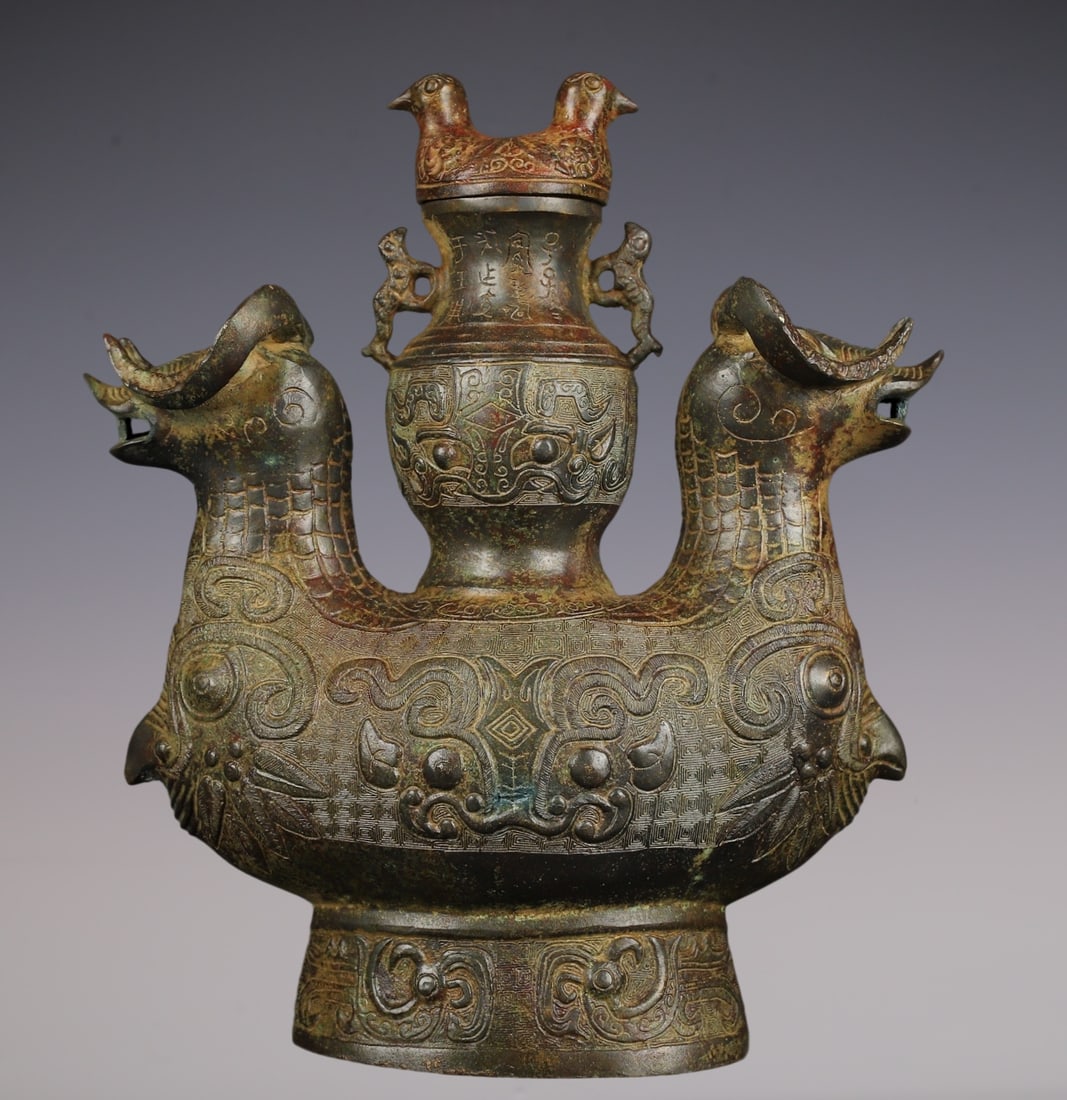 An Archaic Bronze Beast-Face Pattern Sheep-Shaped Vase,With Inscription: An Archaic Bronze Beast-Face Pattern Sheep-Shaped Vase,With Inscription,W.Zhou ,China,Size:9.8inx12.6in,Weight:4000g青铜兽面纹羊形瓶,带铭