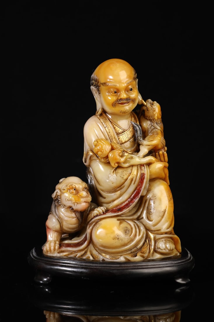 An Exquisite Shoushan Stone Statue of Arhat Ornament: An Exquisite Shoushan Stone Statue of Arhat Ornament Qing Dynasty, China Size:6.7inx4.3in Weight:1320g寿山石罗汉戏狮摆件 中国清&