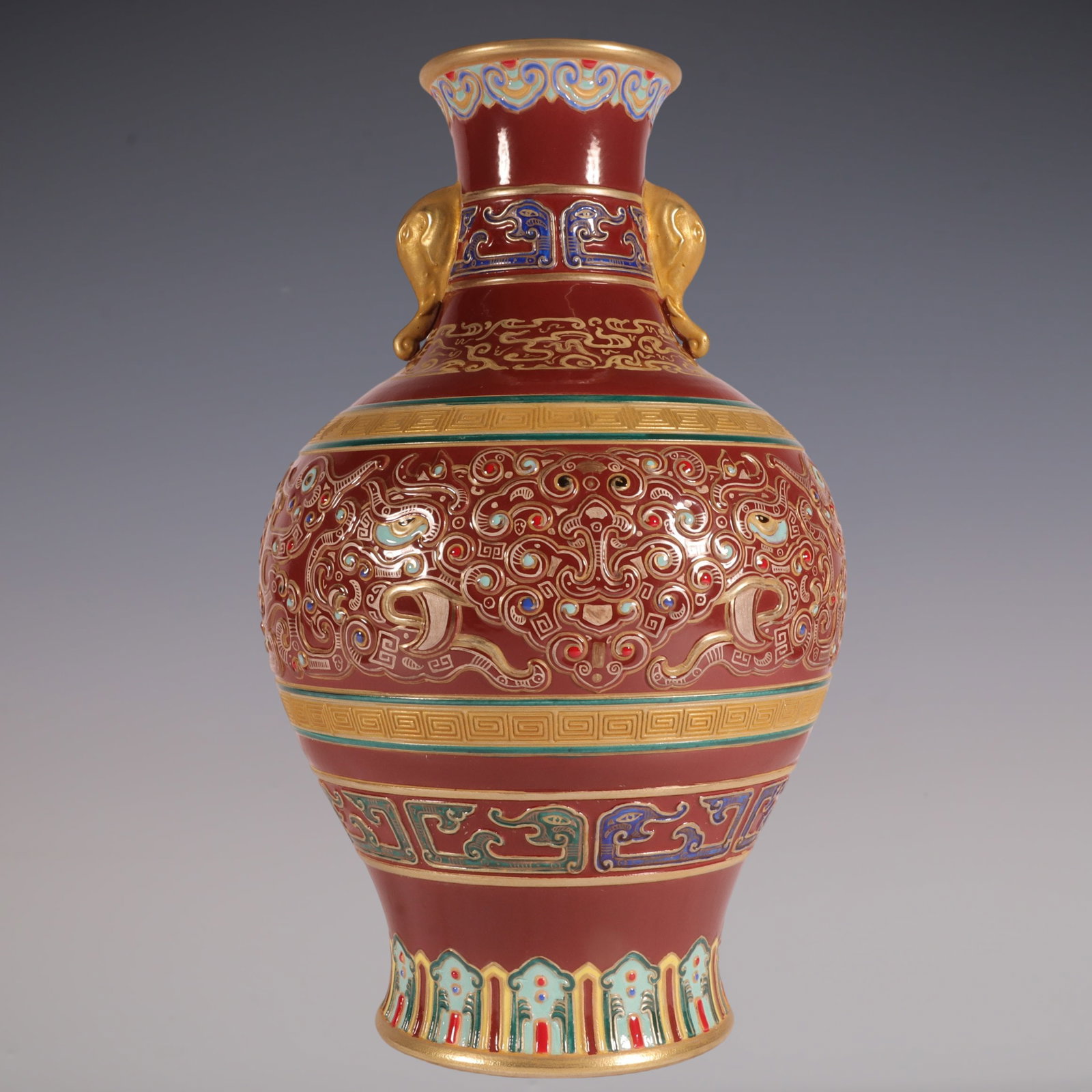 An Exquisite Enamel Painted Gold Beast-Face Pattern Double-Ears Vase: An Exquisite Enamel Painted Gold Beast-Face Pattern Double-Ears Vase Qing Dynasty, China Qianlong Six-character Mark Size:10.1inx5.5in珐琅彩棕色地雕刻&#