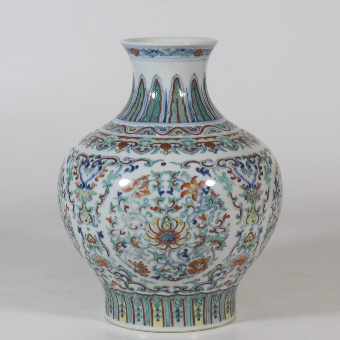 An Exquisite Blue and White Doucai Lotus Pattern Vase: An Exquisite Blue and White Doucai Lotus Pattern Vase,Qing Dynasty,China,Qianlong Six-character Mark,Size:8.2inx2.9in青花斗彩缠枝莲纹瓶,中&#
