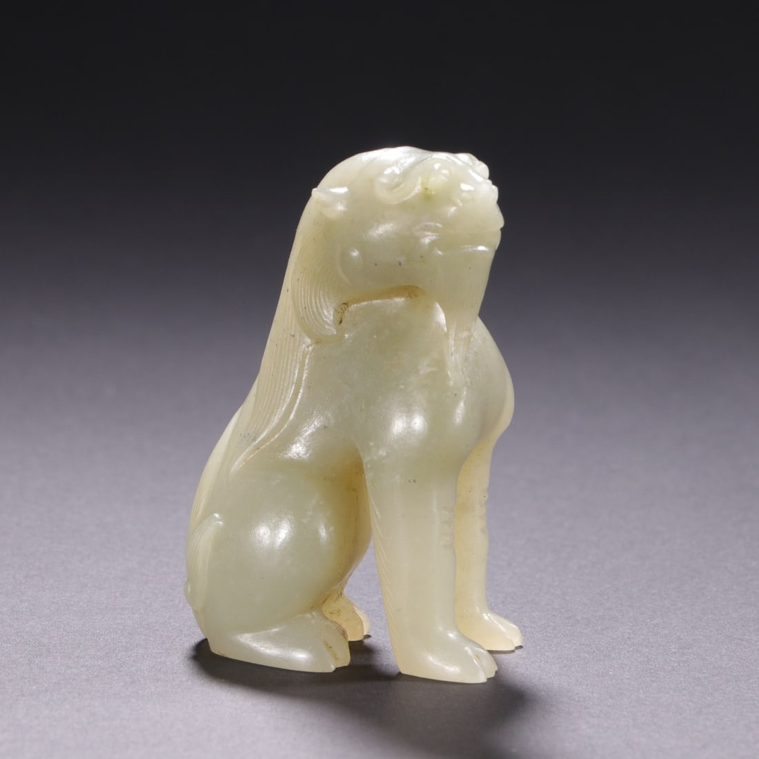 An Exquisite White Jade Auspicious Beast Ornament: An Exquisite White Jade Auspicious Beast Ornament,Qing Dynasty,China,Size:1.5inx2.4in,Weight:70g白玉瑞兽摆件,中国清代,Size:3.9cmx6cm,Weight: