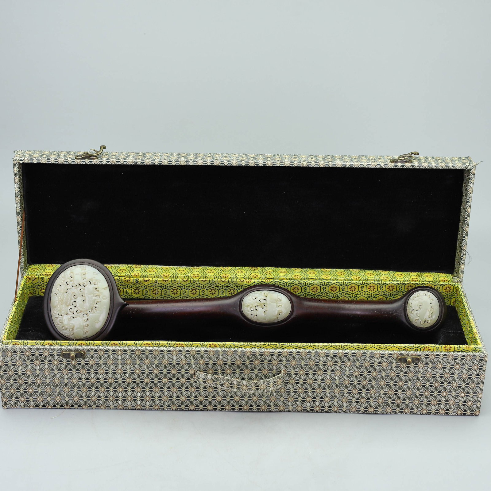 A Huge Zitanwood Inlaid White Jade Sheep Pattern Ruyi: A Huge Zitanwood Inlaid White Jade Sheep Pattern Ruyi,Qing Dynasty,China,Size:(Box)4.9inx22inx6.3in,(Ruyi)19.3inx4.3inx3.3in,Total Weight:1820g紫檀木镶白玉羊&