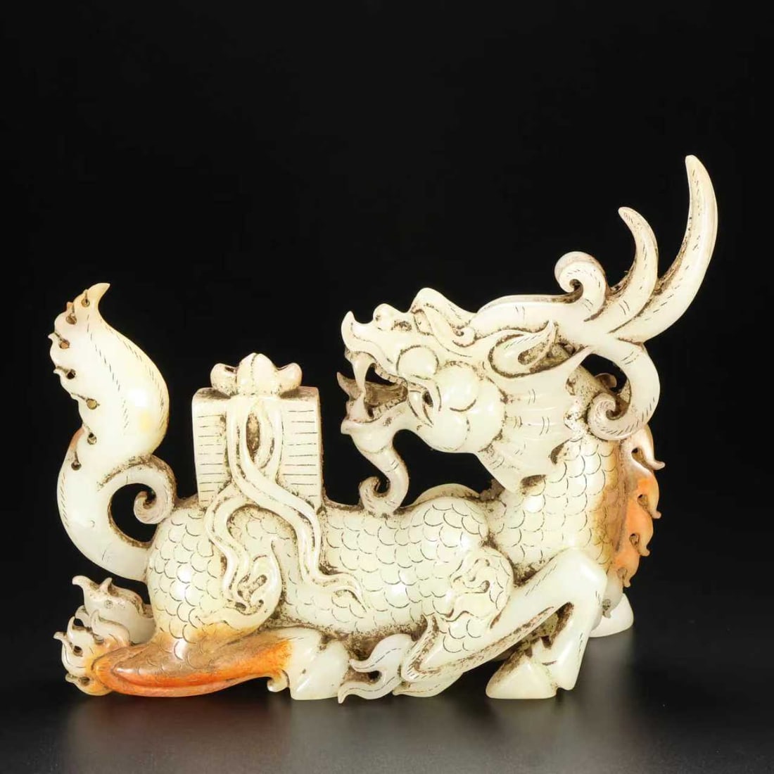 A Exquisite Hotan Jade Kylin Ornament: A Exquisite Hotan Jade Kylin Ornament,Han Dynasty, China,Size:7.1inx2.4inx5.5in ,Weight:890g 和田玉麒麟摆件,中国汉代