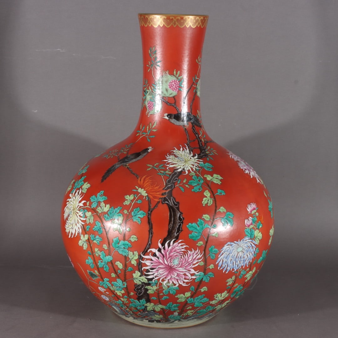 A Exquisite Coral Red Ground Famille-Rose Painted Gold Flower and Bird Pattern Vase: A Exquisite Coral Red Ground Famille-Rose Painted Gold Flower and Bird Pattern Vase,Qing Dynasty, China,Qianlong Six-character Mark,Size:22.4inx5.1inx16.9inx8.3in 珊瑚红地ľ