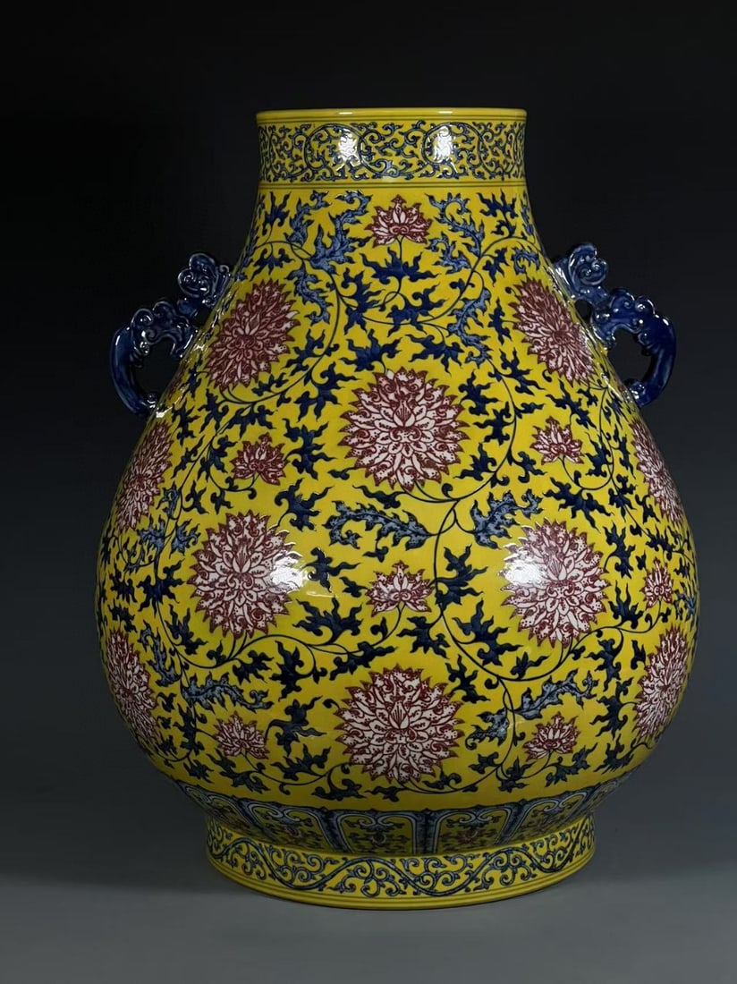 A Exquisite Yellow Ground Underglaze-Red Lotus Pattern Vase: A Exquisite Yellow Ground Underglaze-Red Lotus Pattern Vase,Qing Dynasty, China,Qianlong Six-character Mark,Size:19.7inx6.9inx10.5in 黄地釉里红缠枝莲