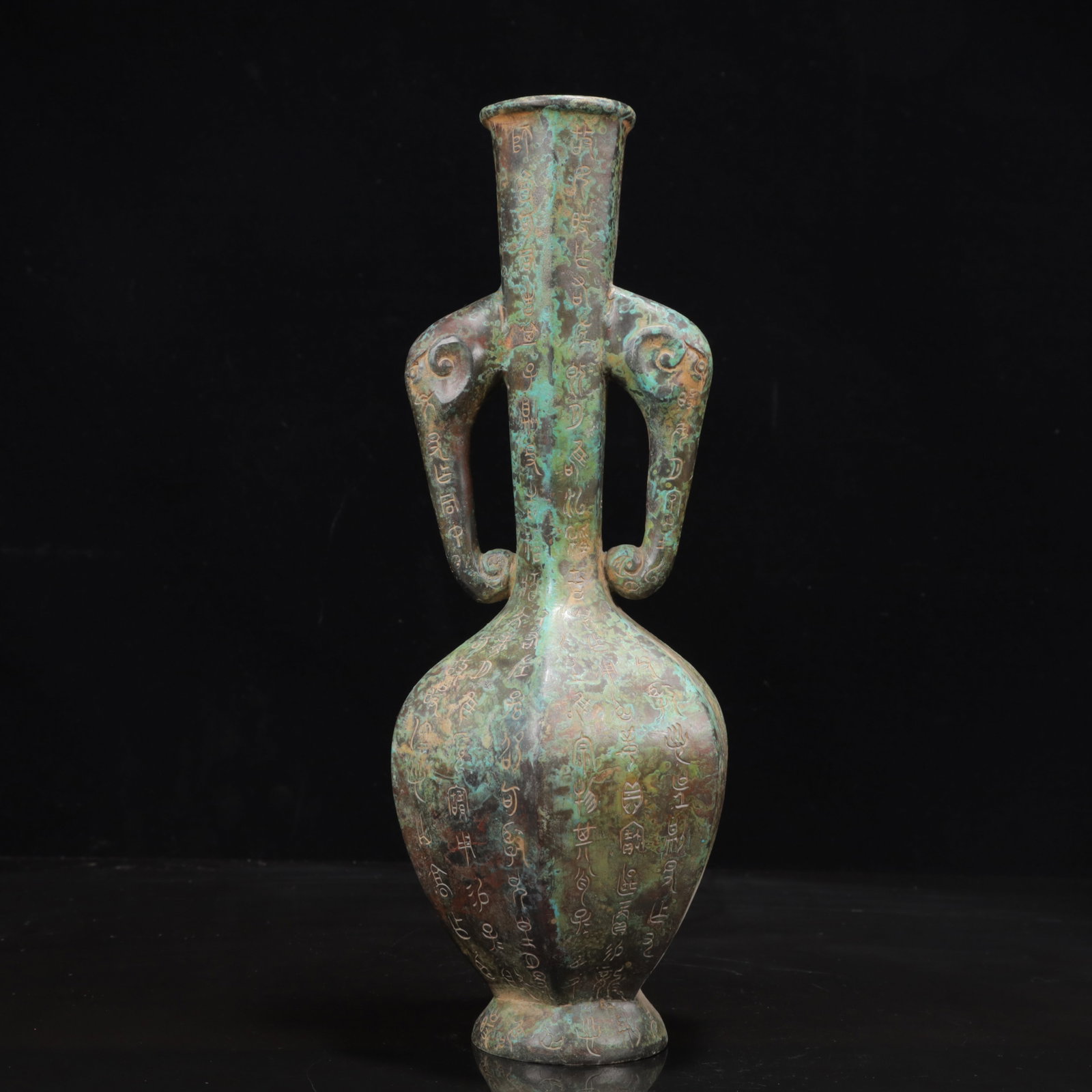 An Archaic Bronze Inscription Elephant-Ears Vase: An Archaic Bronze Inscription Elephant-Ears Vase,the Warring States Period in China,Size:4.7inx13.4in,Weight:1800g 青铜铭文象耳瓶,中国战