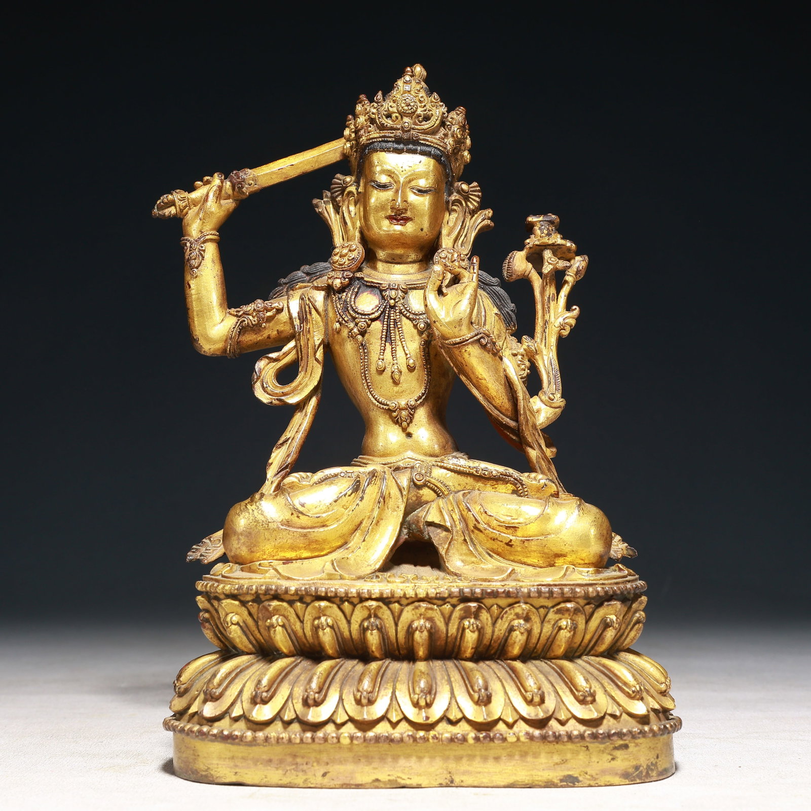A Solemn Gilt Bronze Statue of Manjusri: A Solemn Gilt Bronze Statue of Manjusri,Qing Dynasty,China,Size:5.5inx3.9inx8.7in,Weight:2650g 铜鎏金文殊菩萨像,中国清代