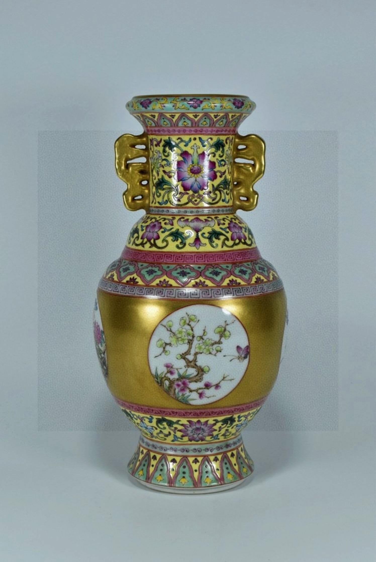 An Exquisite Enamel Gilt Flower and Butterfly Pattern Double-Ears Vase: An Exquisite Enamel Gilt Flower and Butterfly Pattern Double-Ears Vase,Qing Dynasty,China,Qianlong Six-character Mark,Size:10.2inx5.1in 珐琅彩鎏金花卉蝴