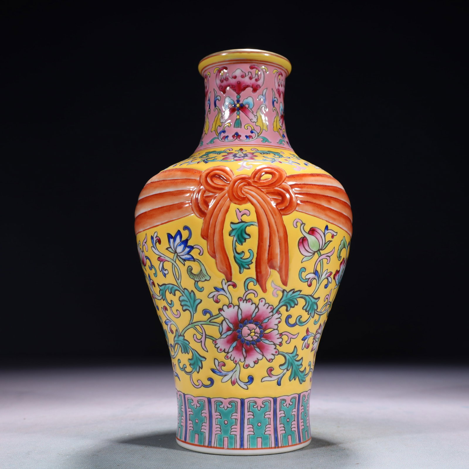 An Exquisite Yellow Ground Famille-Rose Lotus Pattern Vase: An Exquisite Yellow Ground Famille-Rose Lotus Pattern Vase,Qing Dynasty,China,Qianlong Six-character Mark,Size:5.1inx9.4in,Weight:1000g 黄地粉彩缠枝莲纹