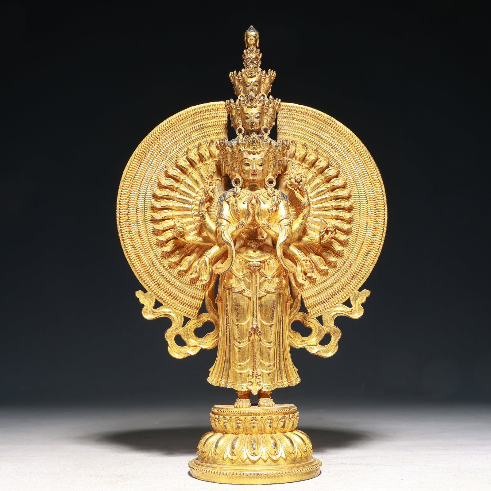 A Solemn Gilt Bronze Statue of Thousand-hand Guanyin: A Solemn Gilt Bronze Statue of Thousand-hand Guanyin,Qing Dynasty,China,Size:7.5inx3.3inx11.8in,Weight:1550g 铜鎏金千手观音像,中国清&#