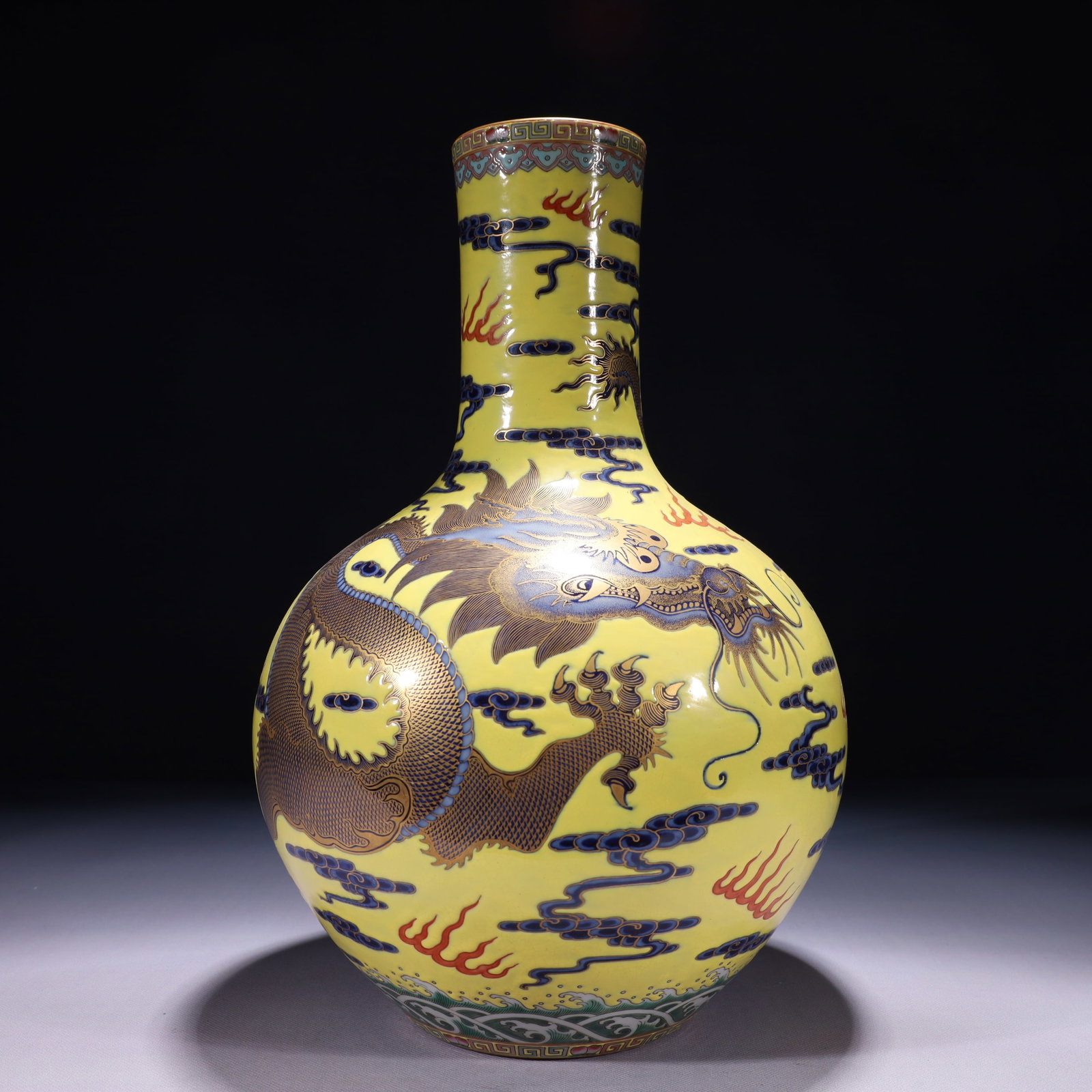 An Exquisite Yellow Ground Famille-Rose Painted Gold Auspicious Cloud and Dragon Pattern Vase: An Exquisite Yellow Ground Famille-Rose Painted Gold Auspicious Cloud and Dragon Pattern Vase,Qing Dynasty,China,Qianlong Six-character Mark,Size:9.1inx15.7in,Weight:3500g 黄地粉