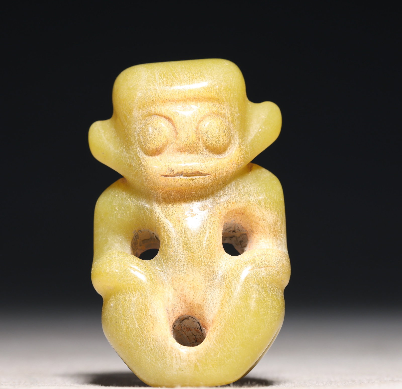 An Archaic Hongshan Culture Yellow Jade Figure Ornament: An Archaic Hongshan Culture Yellow Jade Figure Ornament,Ancient Time, China,Size:1.6inx0.7inx2.4in Weight:69.3g 红山文化黄玉人物摆件,新