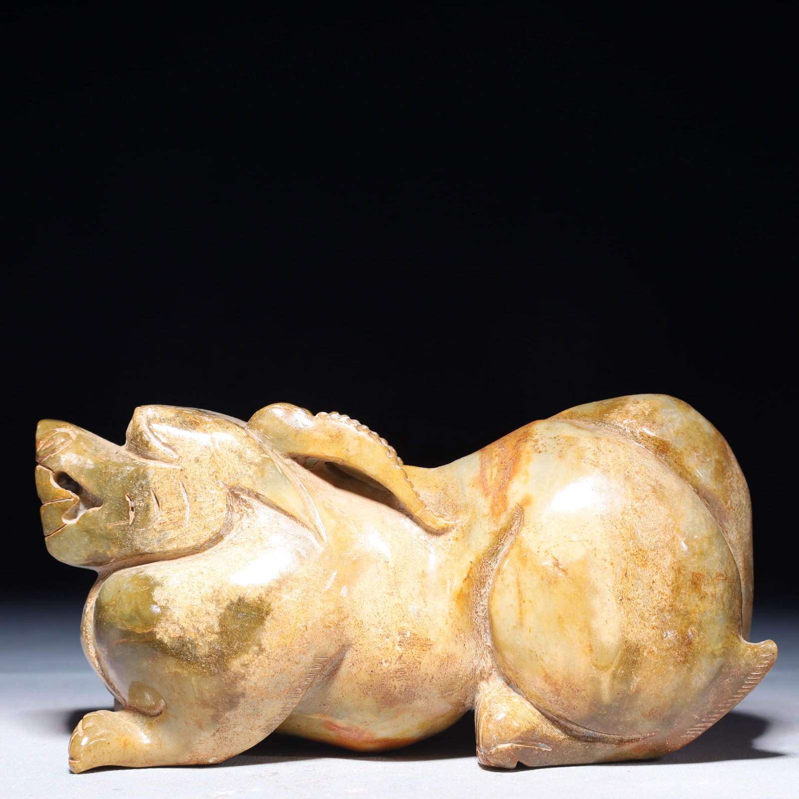 An Exquisite Green Jade Auspicious Beast Ornament: An Exquisite Green Jade Auspicious Beast Ornament,Qing Dynasty,China,Size:6.7inx2inx3.3in,Weight:1900g 青玉瑞兽摆件,中国清代
