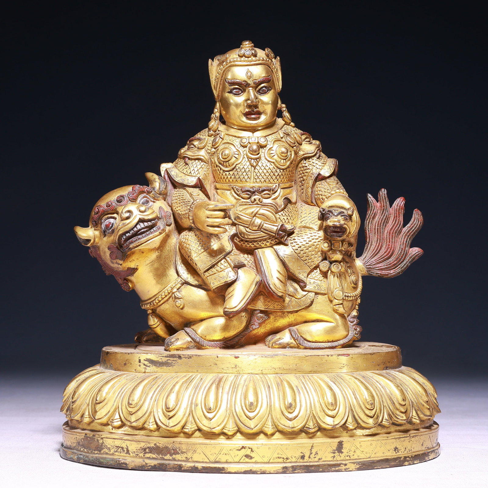 A Solemn Gilt Bronze Statue of Heavenly King Rides the Lion: A Solemn Gilt Bronze Statue of Heavenly King Rides the Lion,Qing Dynasty,China,Size:8.3inx5.9inx9.4in,Weight:4450g 铜鎏金骑狮天王像,中国