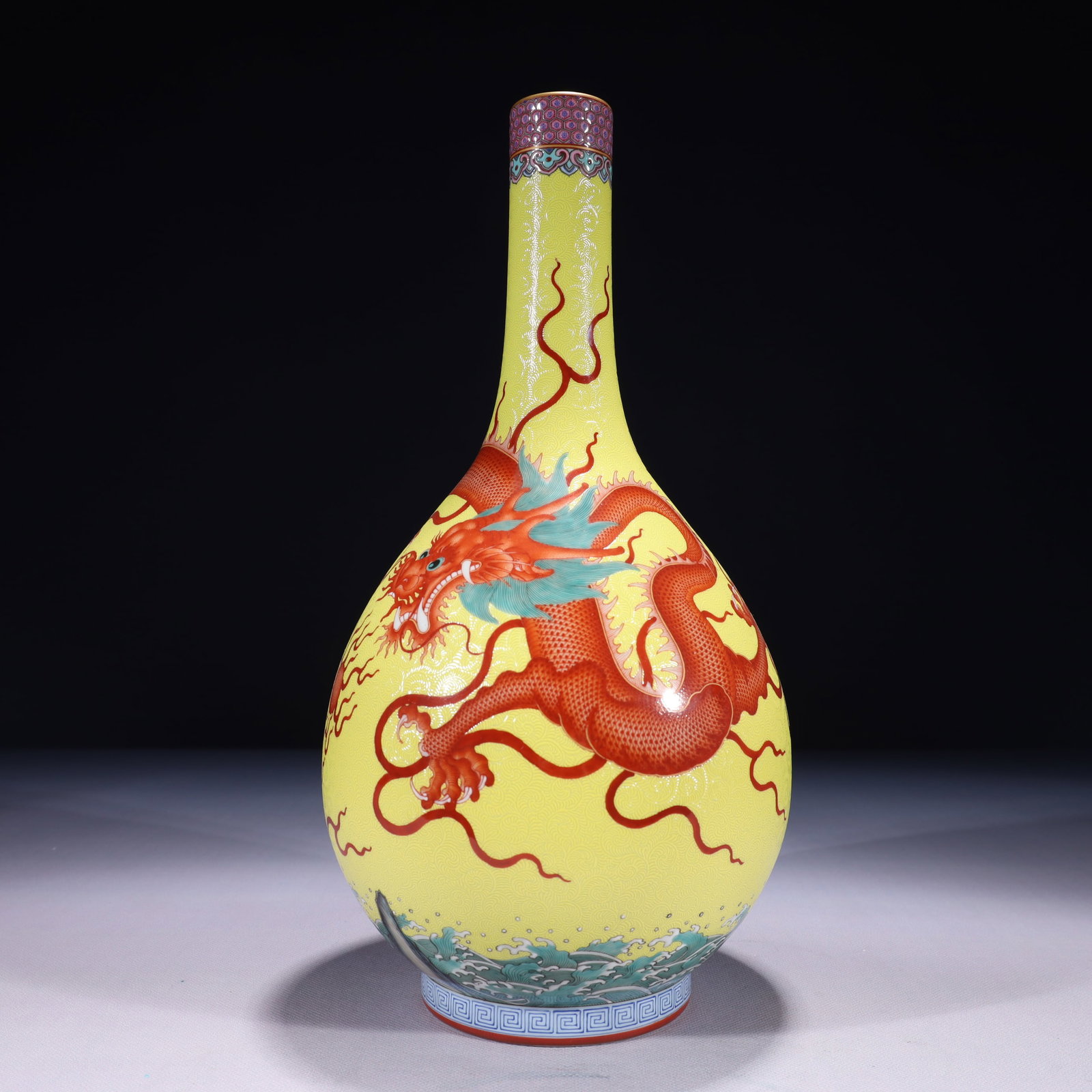 An Exquisite Yellow Ground Famille-Rose Painted Gold Auspicious Cloud and Dragon Pattern Vase: An Exquisite Yellow Ground Famille-Rose Painted Gold Auspicious Cloud and Dragon Pattern Vase,Qing Dynasty,China,Qianlong Six-character Mark,Size:6.3inx14.2in,Weight:1800g 黄地粉