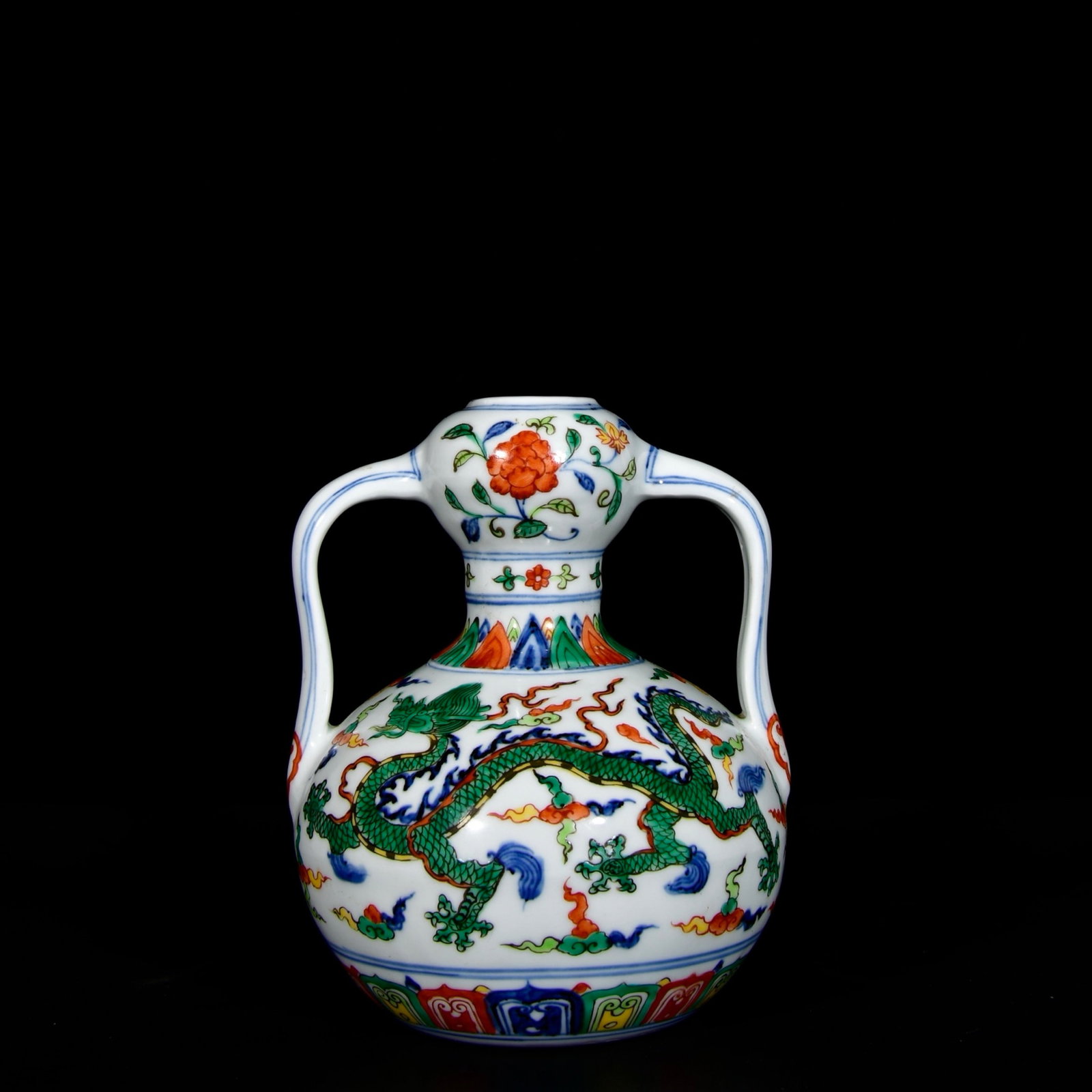 An Exquisite Wucai Auspicious Cloud and Dragon Pattern Double-Ears Vase: An Exquisite Wucai Auspicious Cloud and Dragon Pattern Double-Ears Vase,Ming Dynasty,China,Xuande Six-character Mark,Size:7.9inx6.5in 五彩祥云龙纹双耳&#