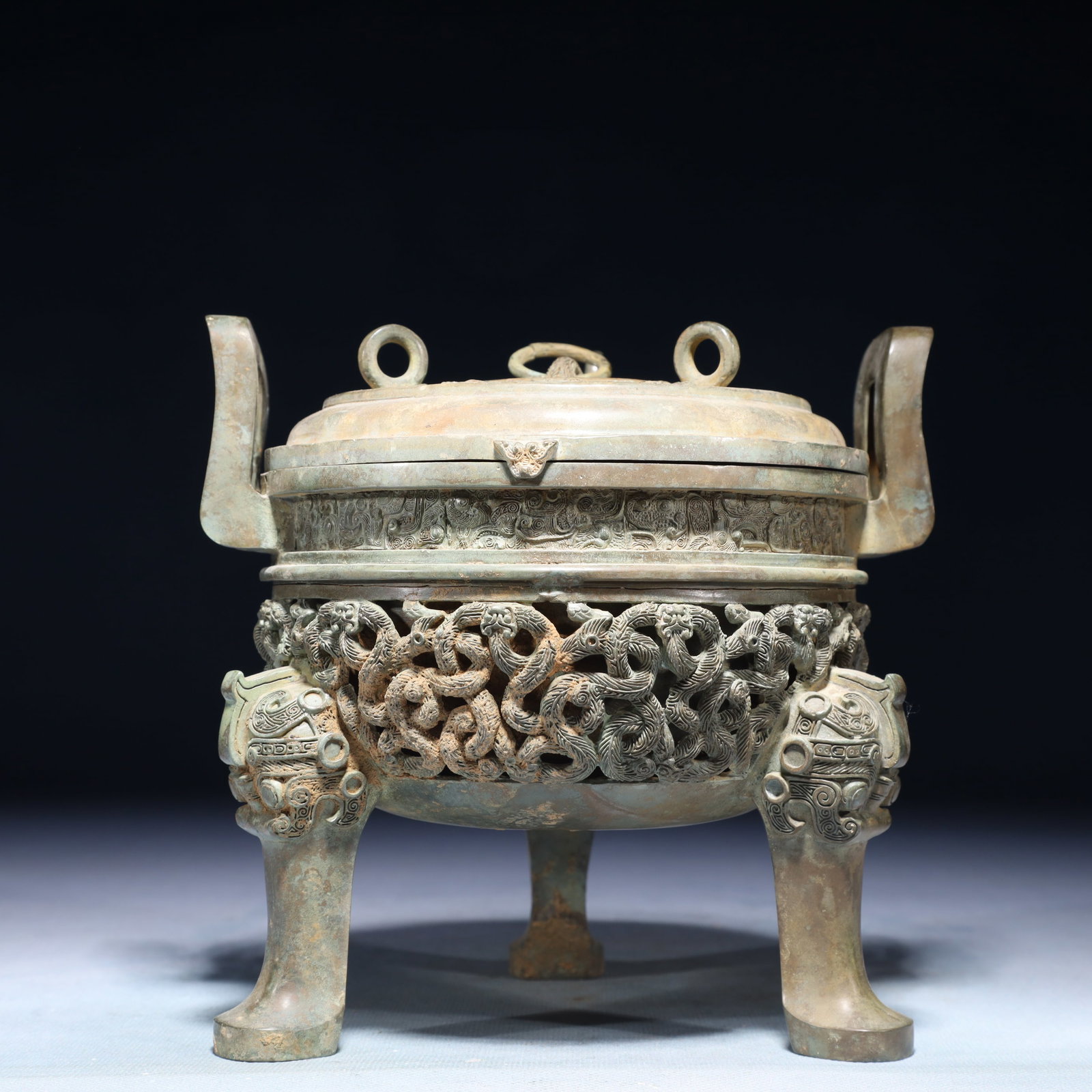 A Rare Bronze Chi-Dragon Pattern Double-Ears and Tripod Censer,With Inscription: A Rare Bronze Chi-Dragon Pattern Double-Ears and Tripod Censer,With Inscription,the Warring States period in China,Size:6.5inx5.9inx6.3in,Weight:1350g 青铜螭龙纹双&