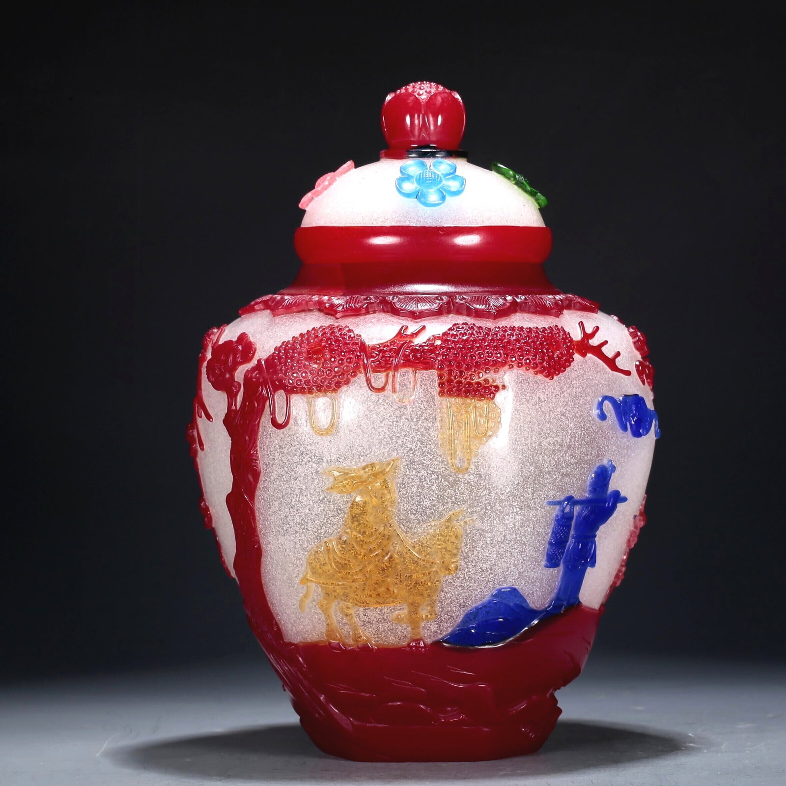 A Multi-Color Overlay White Glass 'Flower, Bird, Figure' Jar And Cover: A Multi-Color Overlay White Glass 'Flower, Bird, Figure' Jar And Cover. Enameled in polychrome with trees and a robed figure playing the flute. Chinese Qing Dynasty. Qianlong Four-Character Mark. Size