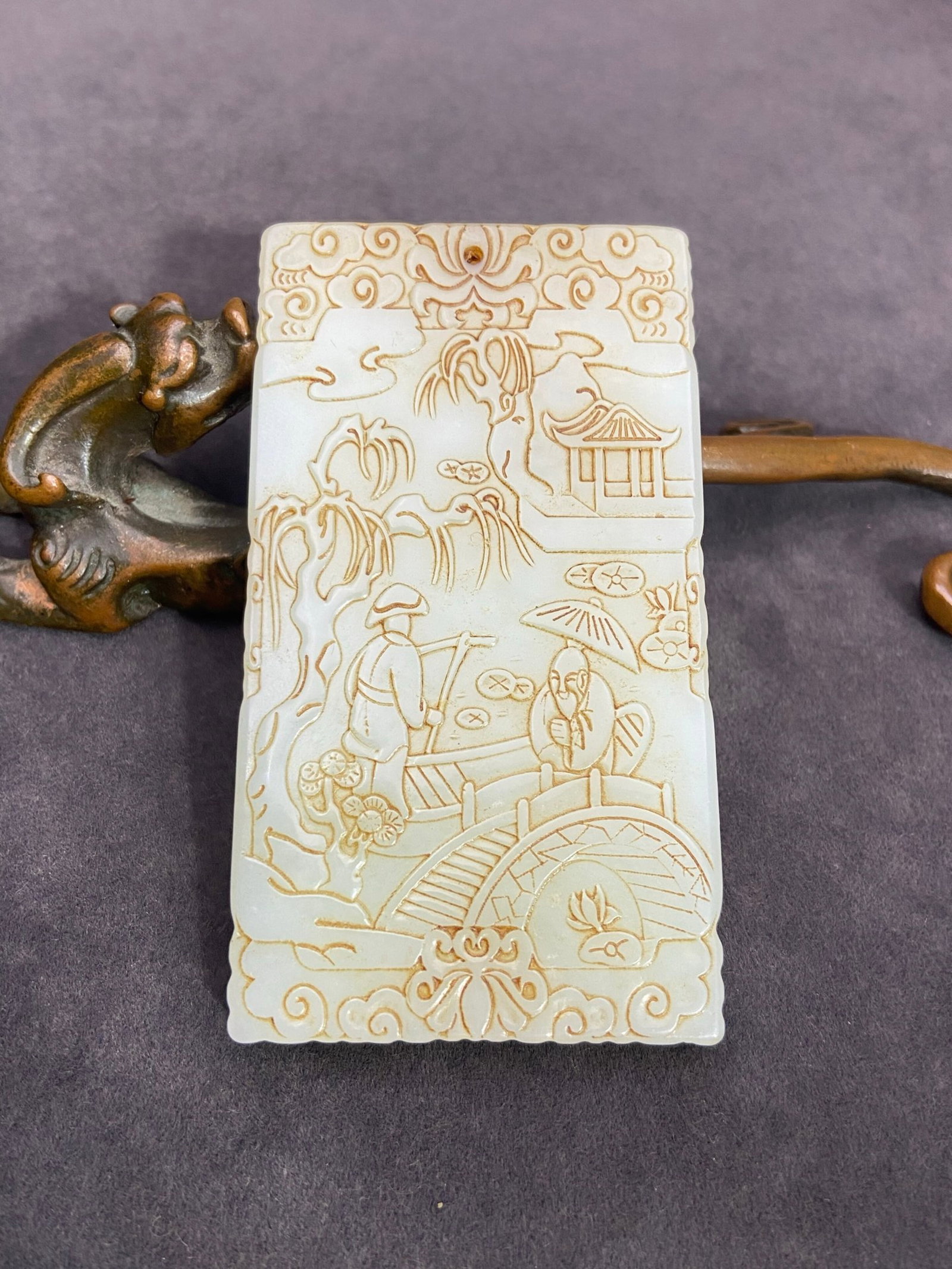 An Exquisite White Jade Landscape and Figure Pattern Pendant,with poem: An Exquisite White Jade Landscape and Figure Pattern Pendant,with poem,Qing Dynasty,China,Size:80mmx44.7mmx6.8mm,Weight:67g 白玉山水人物纹挂件,